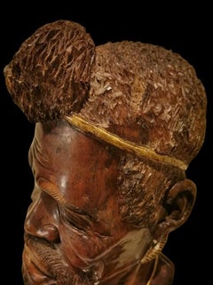 Wooden Sculpture of the 19th century: Head of African with Gilded Decorations
