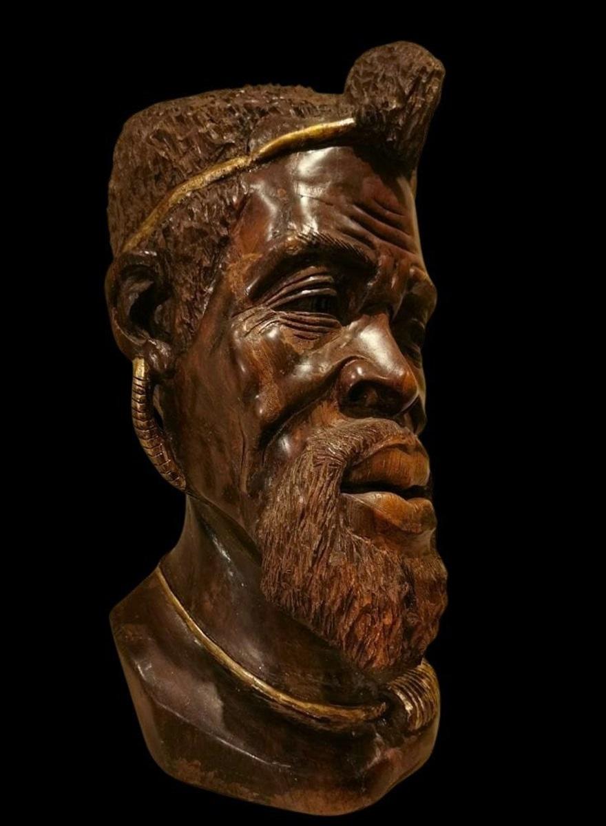 Sub-Saharan African Wooden Sculpture of the 19th century: Head of African with Gilded Decorations For Sale
