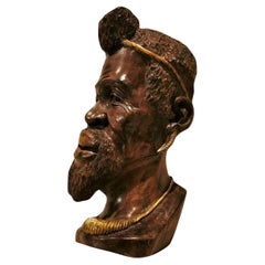 Wooden Sculpture of the 19th century: Head of African with Gilded Decorations