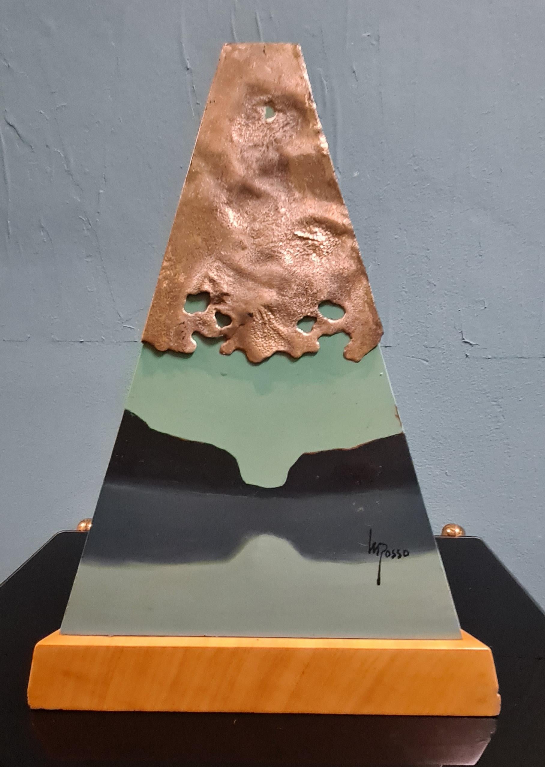 Metaphysical style sculpture signed by artist Mario Rosso.

The sculpture features a triangular wooden base on which towers a painted metal pyramid decorated with silver and a large quartz crystal.

The metaphysical-style painting on the sculpture,