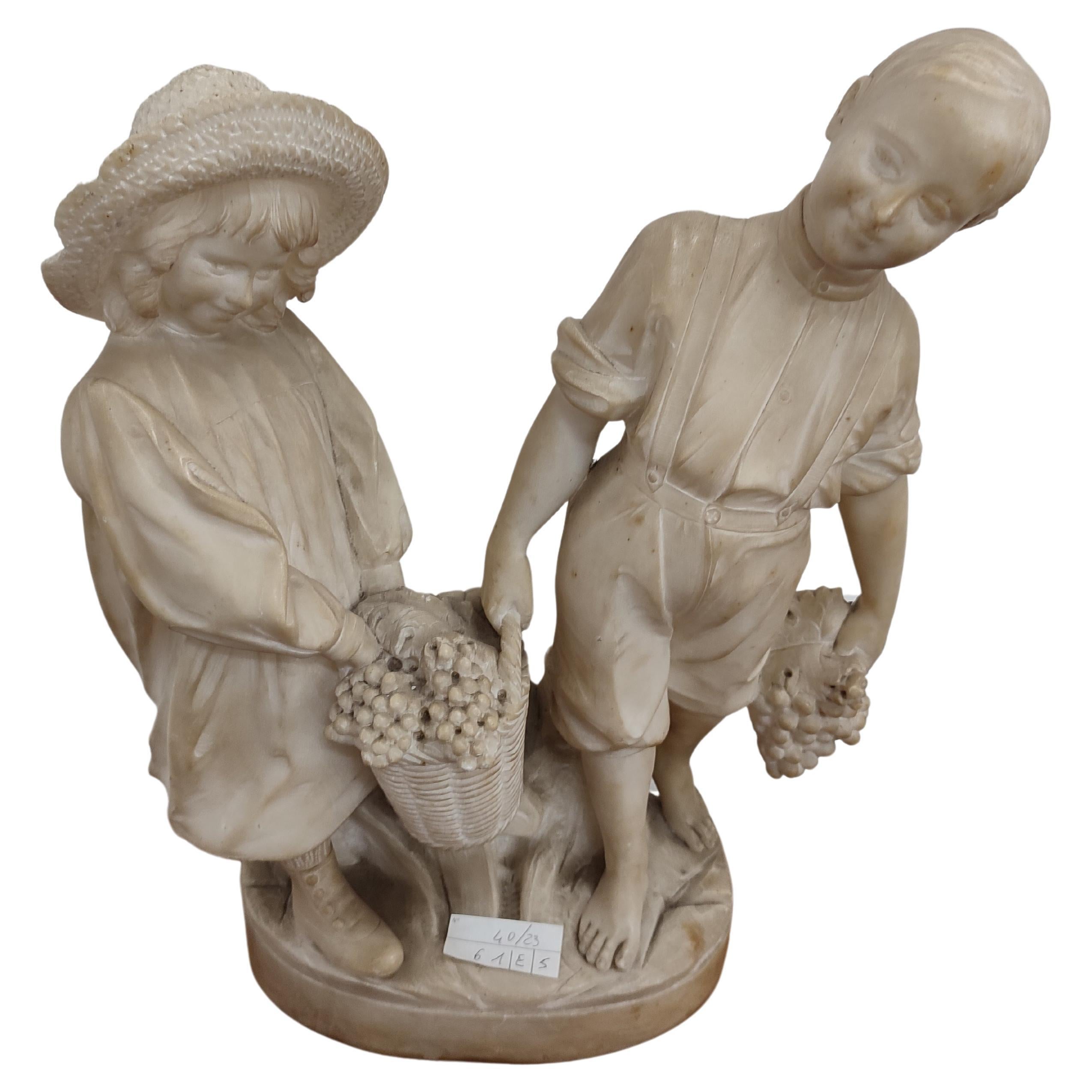 Sculpture depicting couple of children For Sale