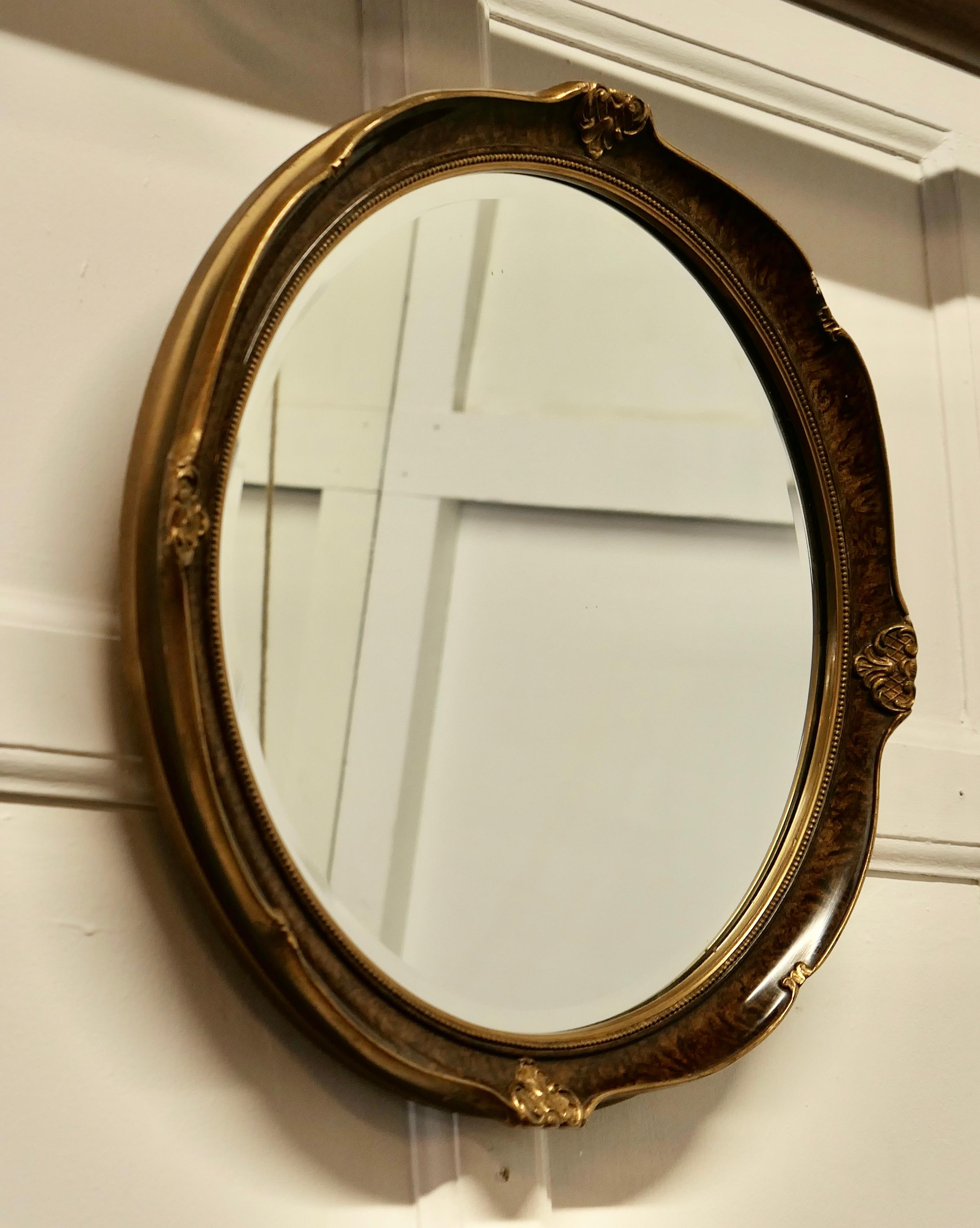 Scumble Finish Oval Mirror

This Mirror has a 2” wide moulded round frame, this has a Scumble finish simulating tortoise shell with a gilt decorated edge 
The frame is in good attractive condition as is the original bevelled looking glass
The