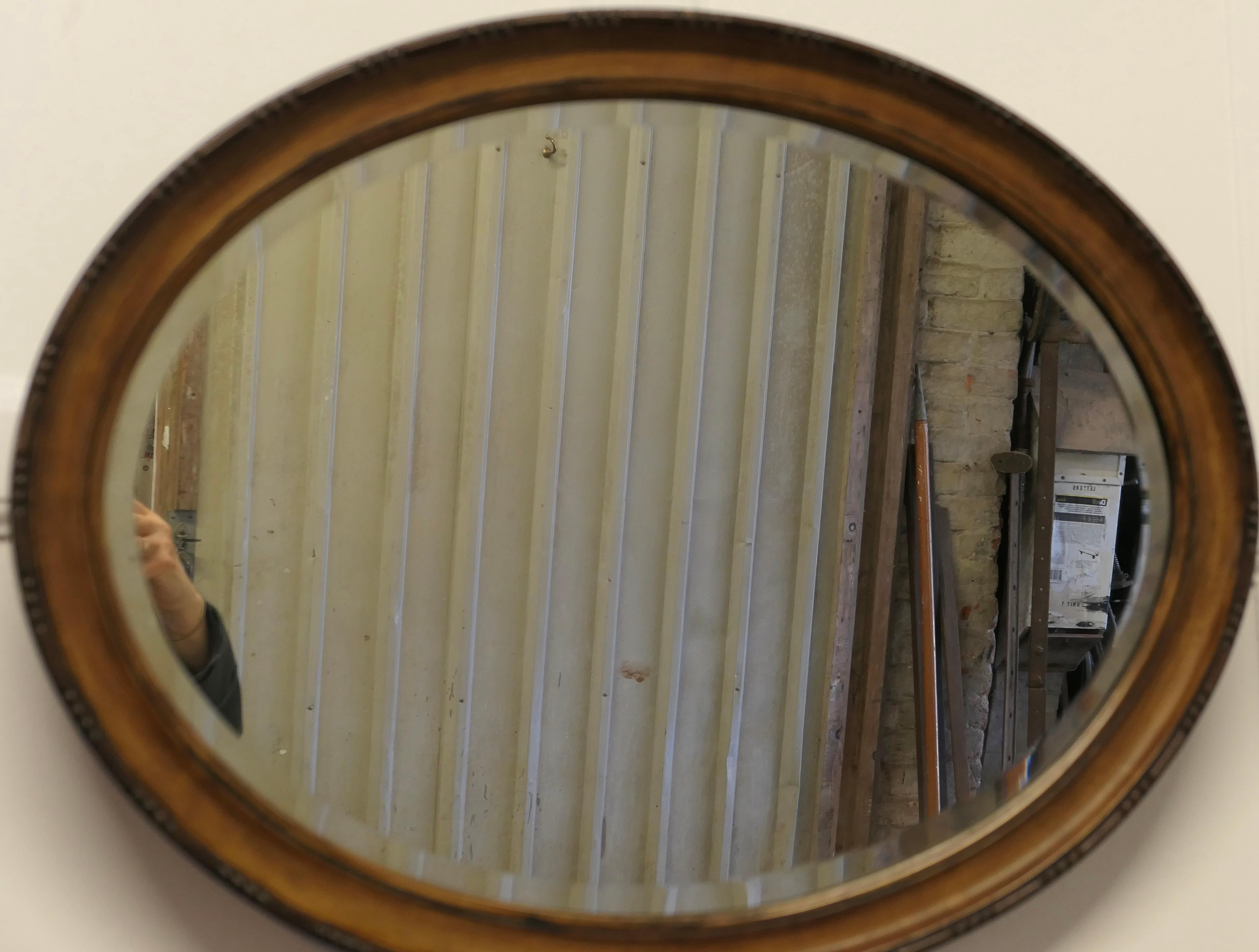 Scumble Finish Oval Mirror

This Mirror has a 2” wide moulded oval frame, this has a Scumble simulated light Walnut finish and a moulded edge 
The Oval frame is in good attractive condition as is the original Oval bevelled looking glass
The