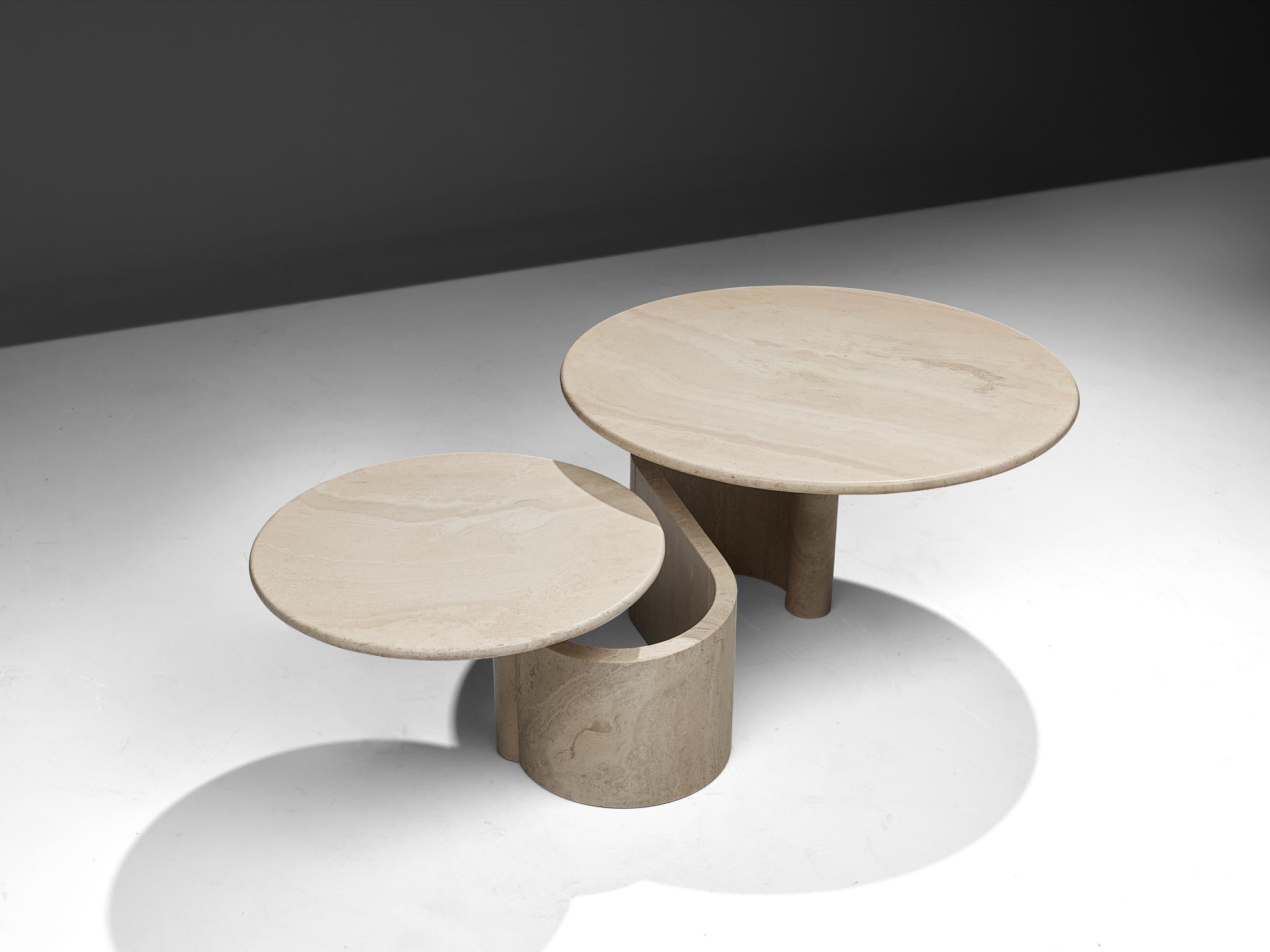 Coffee table, travertine and metal, Italy, 1970s.

A sculptural cocktail table with two tabletops executed in travertine. The base consists of a meandering freeform 