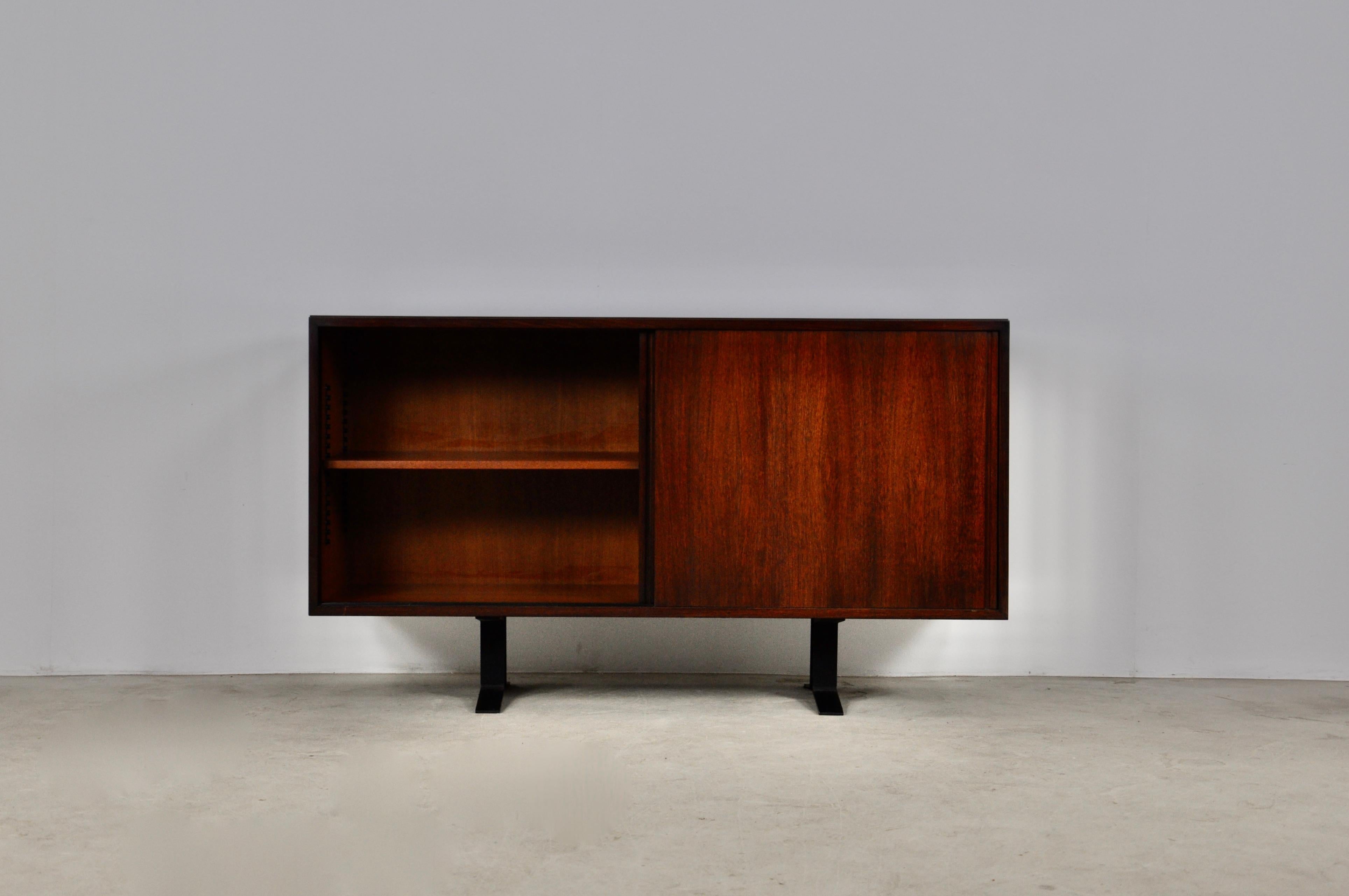 Wooden sideboard, black metal foot composed of two sliding doors. Stamped Tecno. Wear due to time and age of the sideboard.