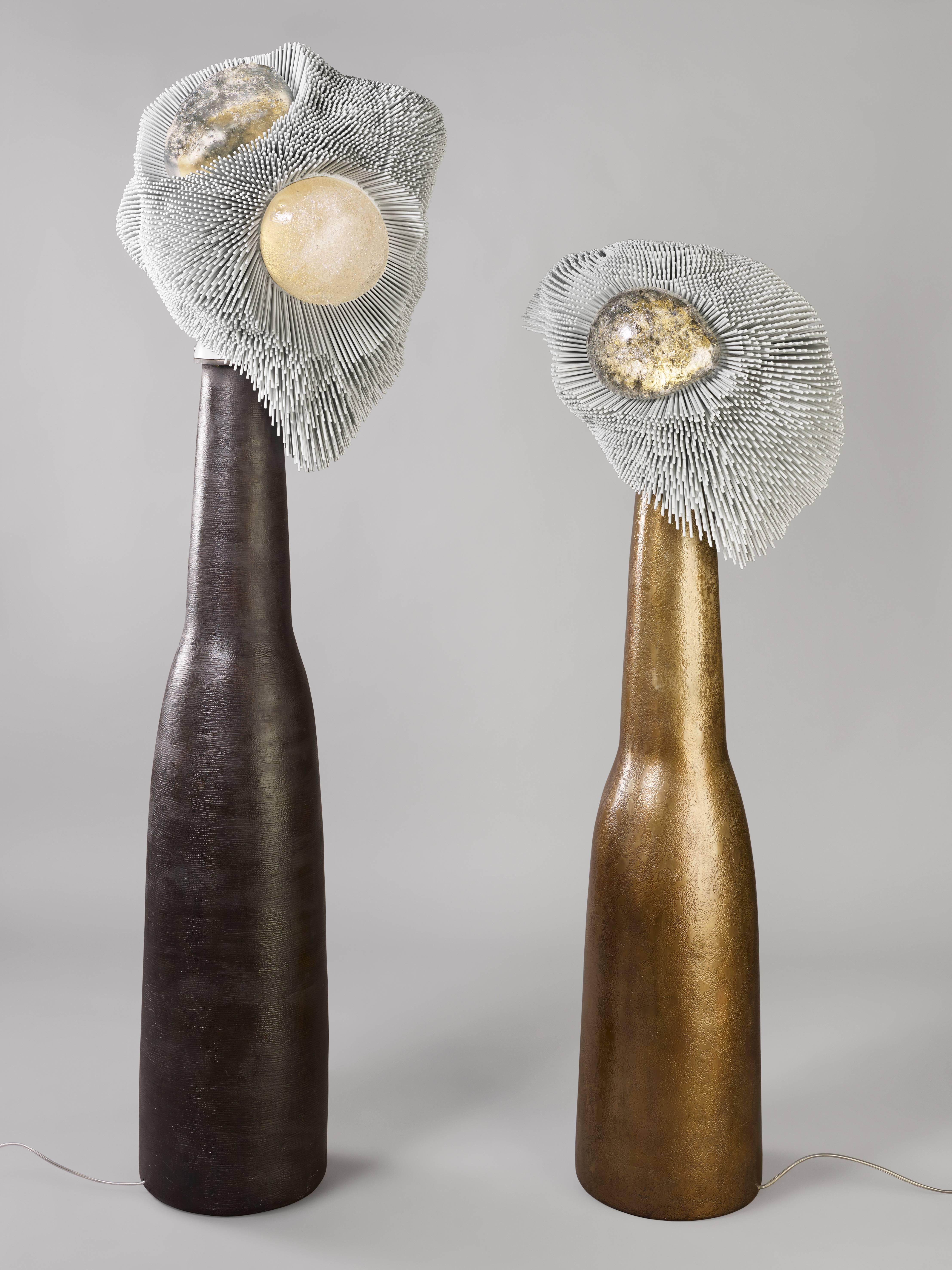 From thousands of simple beech rods patiently cut, sanded and arranged one by one, Pia Maria Raeder creates refined functional sculptures that evoke biomorphic forms. 

The 'Sea Anemones' floor light sculptures are the first lighting pieces ever