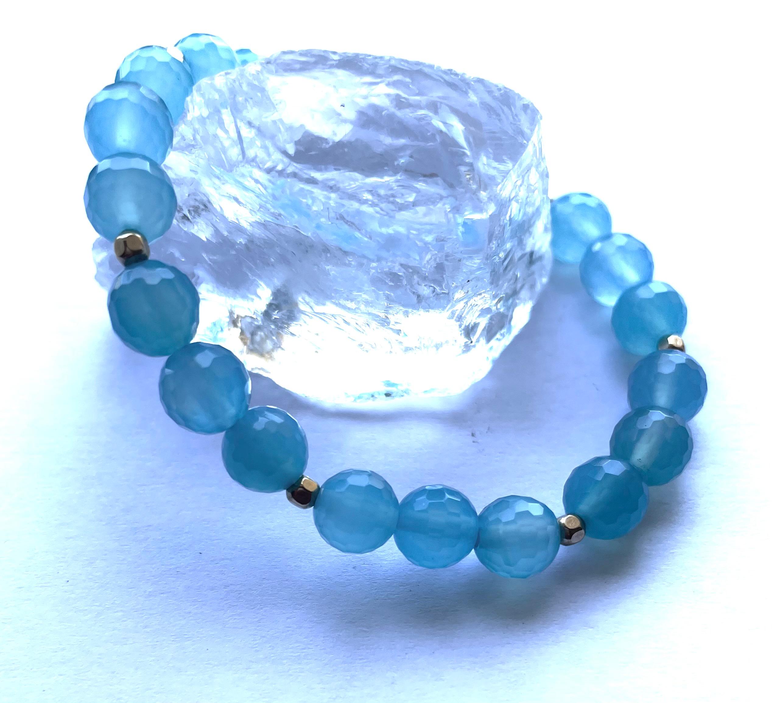 Description
Sea Blue Chalcedony quartz with gold filled faceted balls stretchy bracelet.
Item # B1328. 
Buy 2 bracelets and stack them for a more exquisite look. (Price listed is for 1 bracelet only).

Materials and Weight
Chalcedony quartz 67