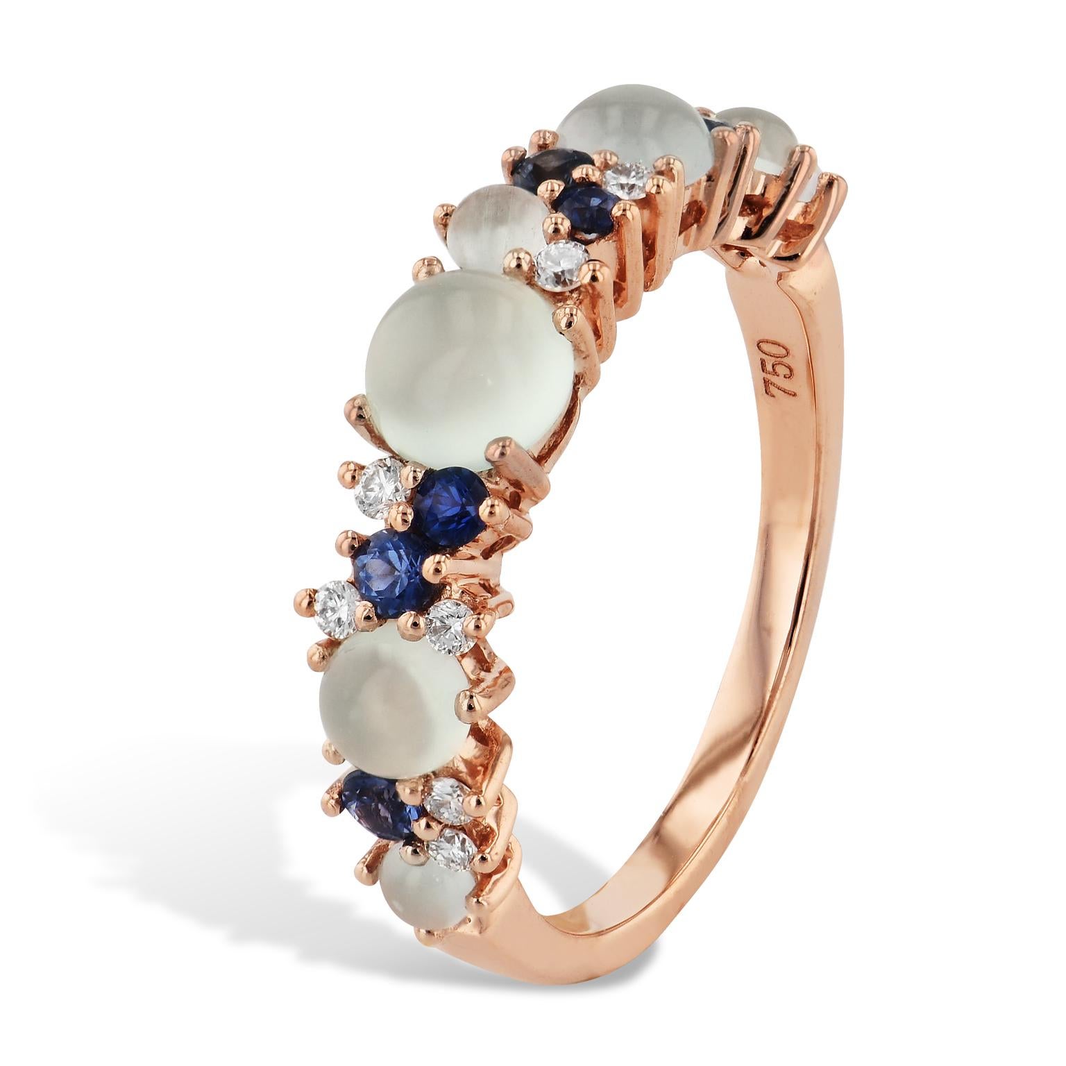 Break out of the ordinary in your style with this eye catching display of cabochon cut chalcedony, diamonds, and blue sapphires all held in a 18 karat rose gold band. 