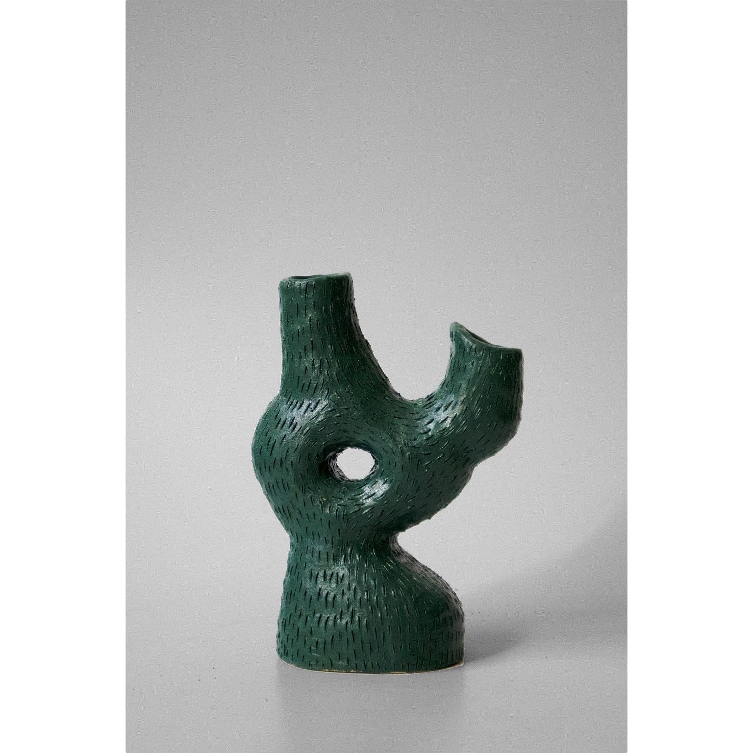 Sea candelabra by Jan Ernst
Dimensions: W 12, D 20, H 25 cm
Materials: Terracotta, Stoneware, Black Clay

Glazed to client specification.
Other dimensions available, please contact us.
2 arms, 1 leg.

The work is influenced by his fascination with