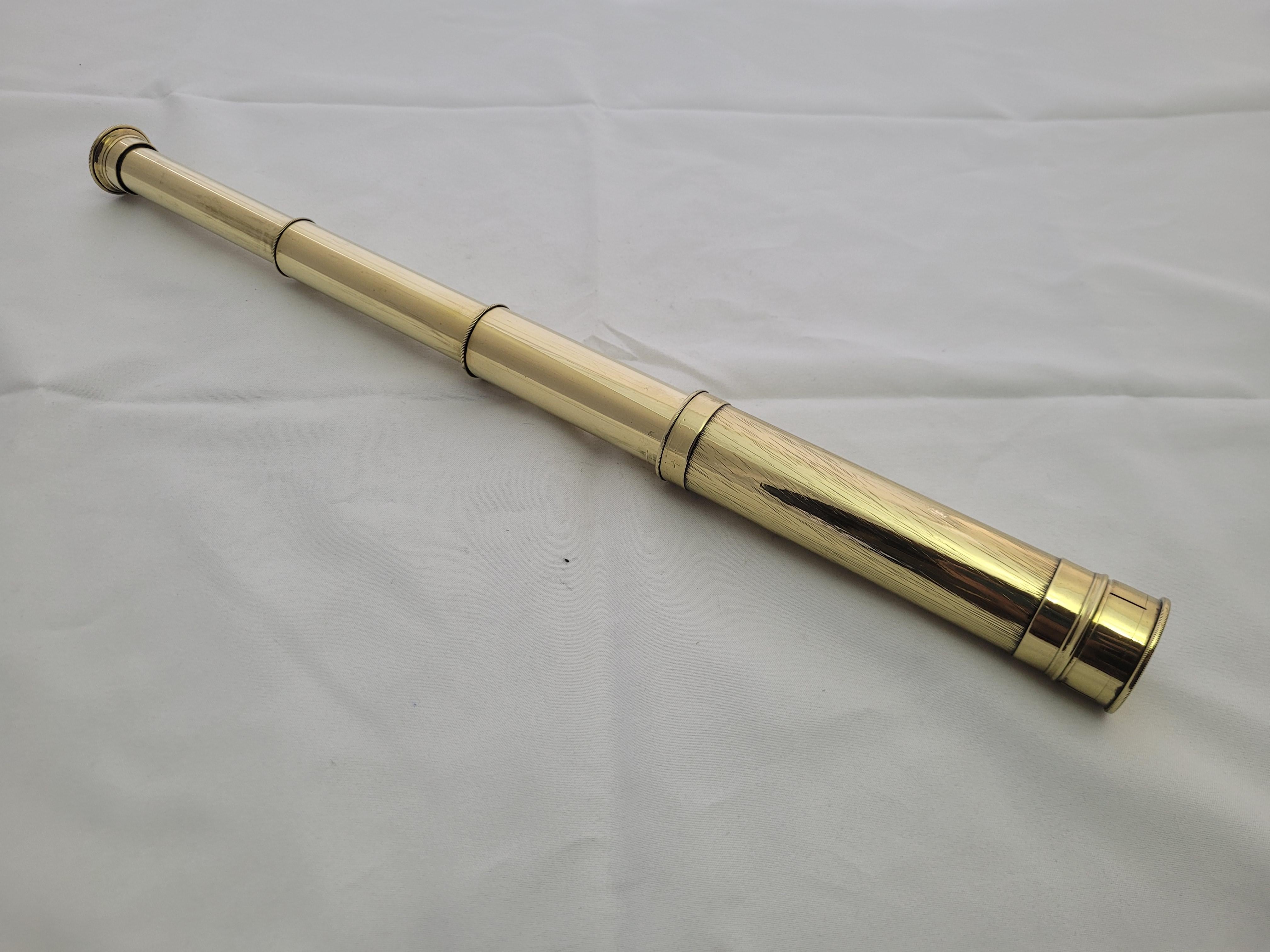 Antique mariners telescope of solid brass that has been polished and the main barrel, eyepiece and cap have been lacquered. The scope has a three draw barrel with eyepiece. Circa 1900

Weight: 1 lb.
Overall Dimensions: 16