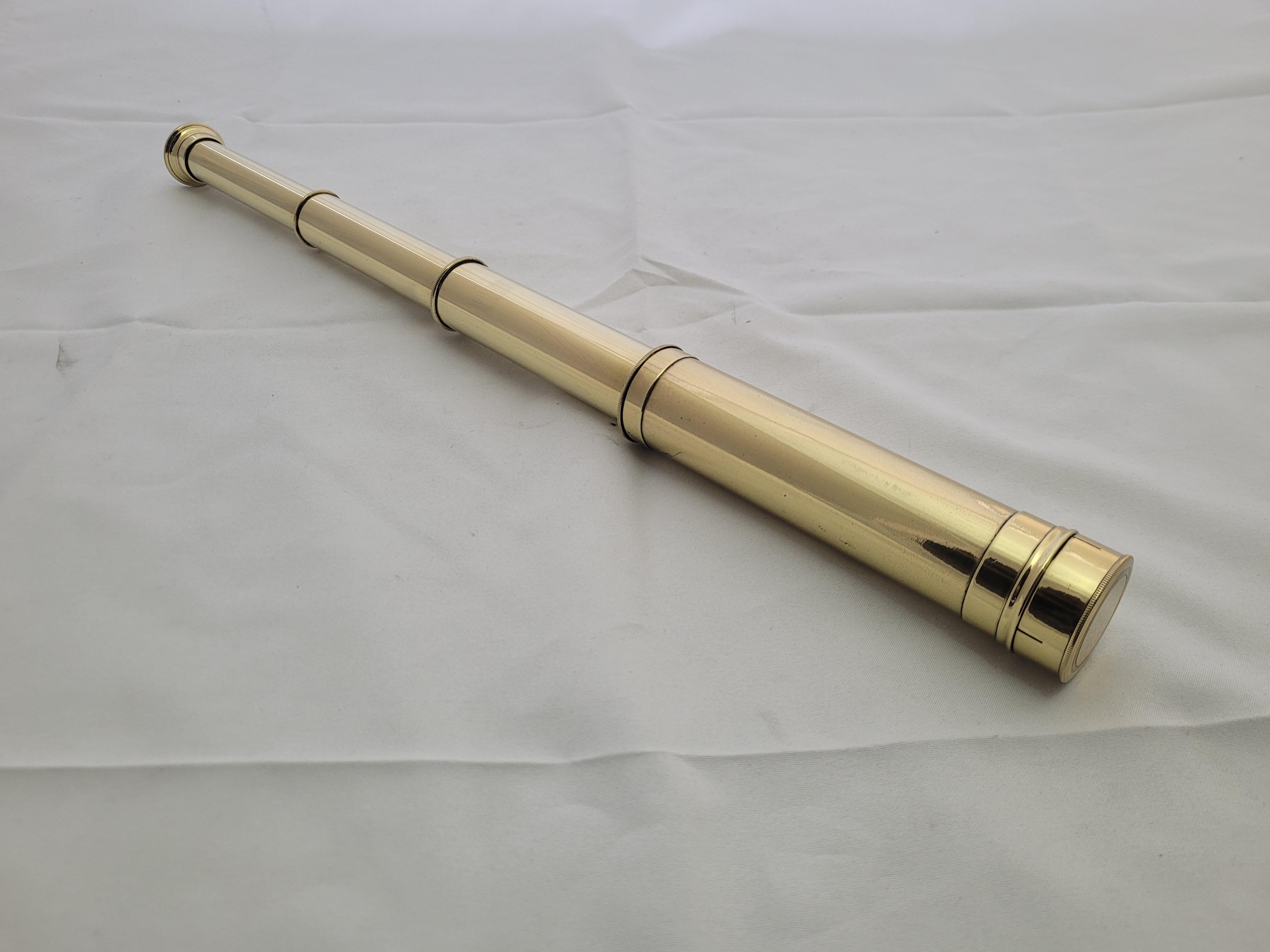 Antique mariners telescope of solid brass that has been polished and the main barrel, eyepiece and cap have been lacquered. The scope has a three draw barrel with eyepiece. Circa 1920. 

Weight: 1 lb.
Overall Dimensions: 16