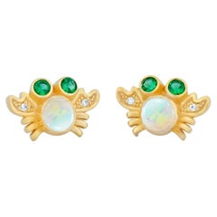Sea Crab earrings studs with opals in 14k gold. 