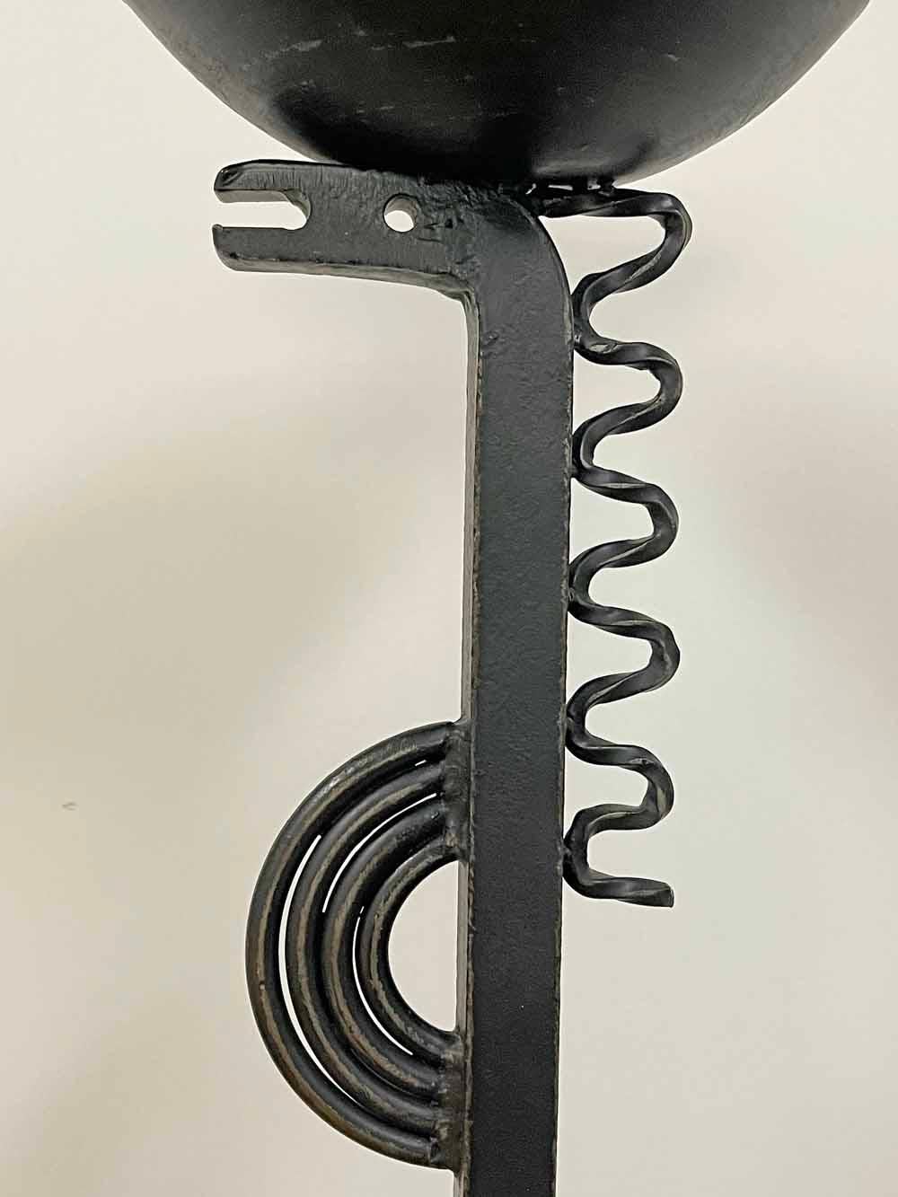 Unique and striking, this Art Deco-Modernist candle stand by Karl Einar Borgström depicts a highly stylized sea dragon using wrought iron bars and rods.  Although this piece has a practical purpose -- it is surmounted by a half-circle iron dish with
