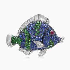 Spilla in oro bianco 18 carati con zaffiro blu, diamante, granato verde e rubino