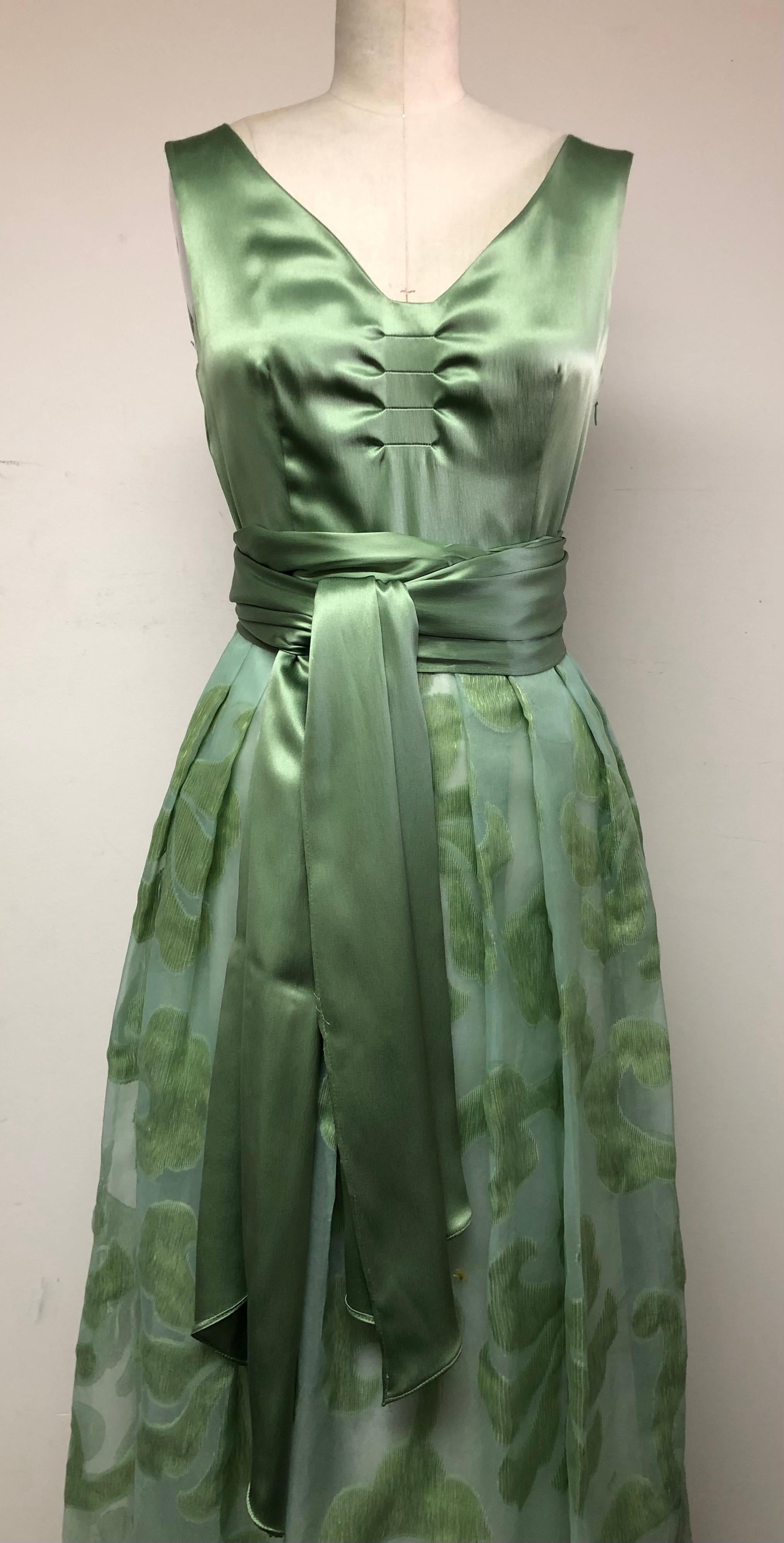 Sea Foam green Satin Tucked Bodice with Matching Sash and Fil Coupe Skirt make for 
statement making combo. In fact the dress was chosen to be featured in Van Cleef Arpels Ad
Campaign. Perfect for Mother of Bride or Groom, Wedding Guest, Spring