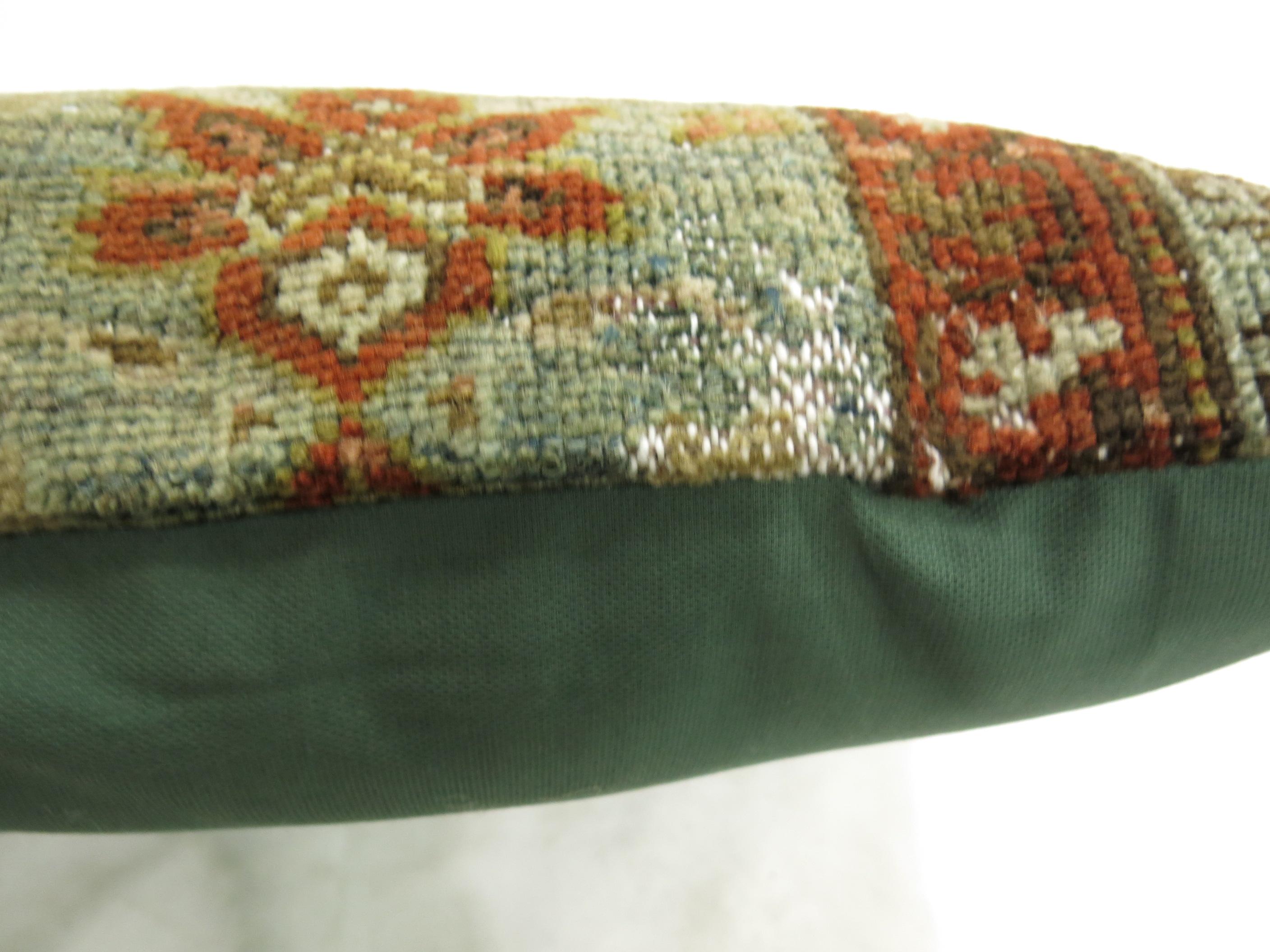 Pillow made from a sea foam colored 20th century Persian rug.

Measures: 14