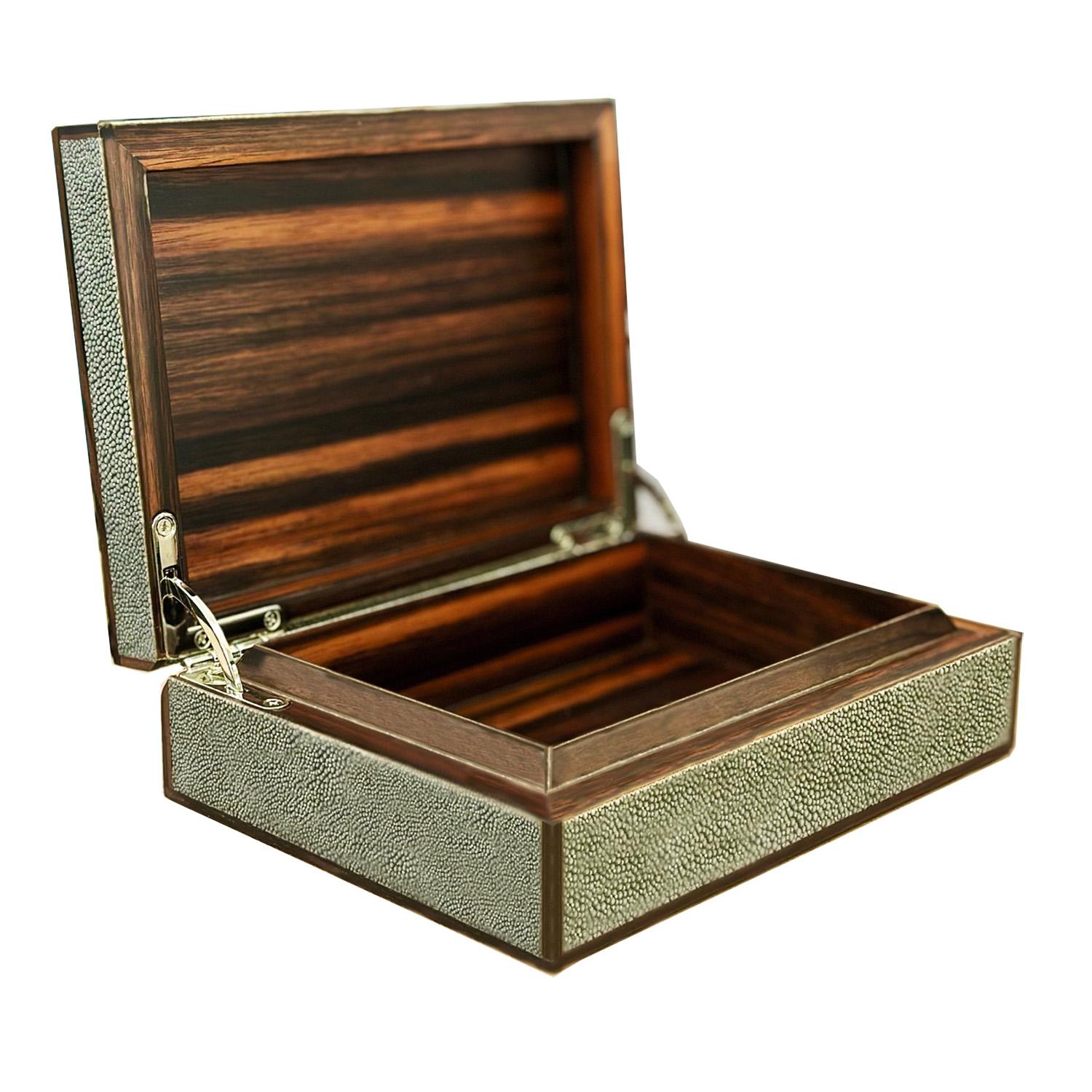 Elegant, exotic, and unmistakably refined, shagreen has long captivated those with a discerning eye for luxury.

A study in subtle opulence, this artisan-crafted decorative box is wrapped in premium stingray shagreen—each panel selected for its