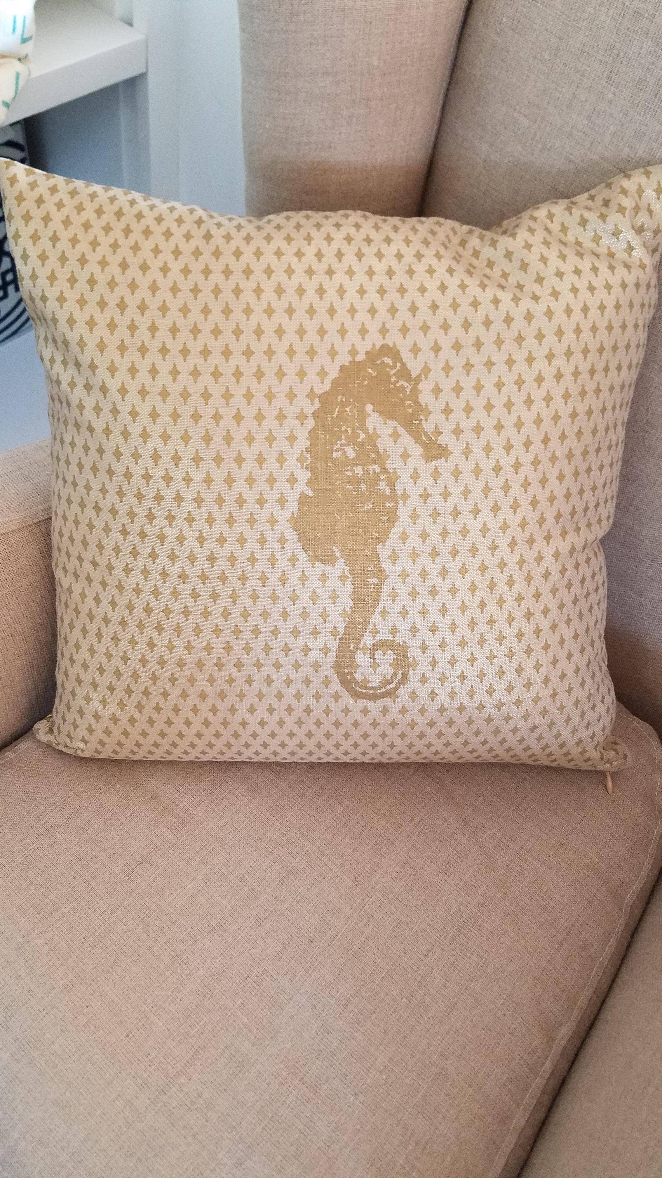 This pillow is silk screened on raw silk in gold featuring a sea horse in a field of regular geometric elements. One of a kind. Insert is poly/dac. Made in USA.