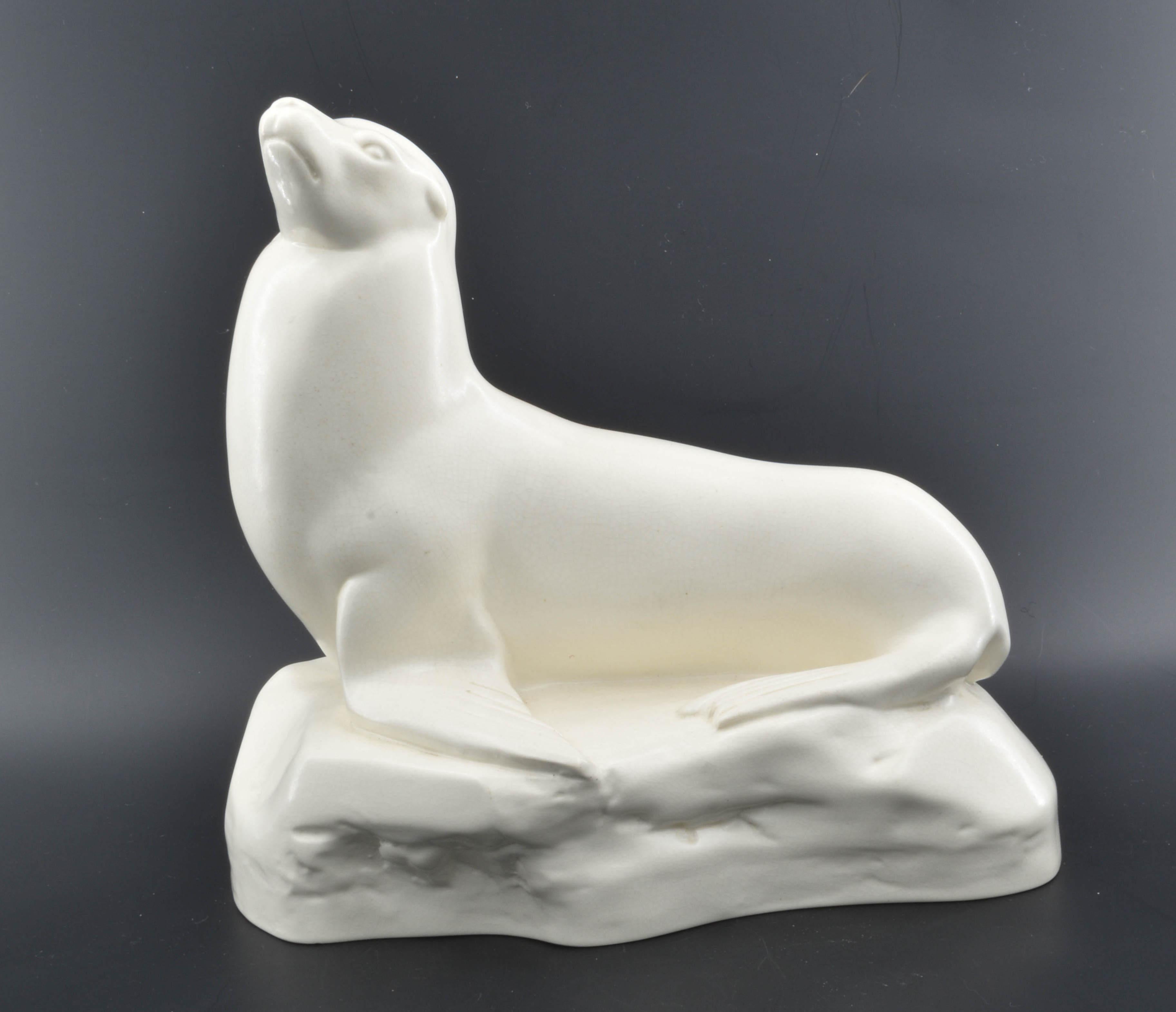 In creamware, with moonstone glaze. The mould sculpted by John Skeaping. Signed for both Wedgwood and Skeaping.

Skeaping was commissioned by Wedgwood to produce a series of animal sculptures in the Art Deco style. They were designed to be simple,
