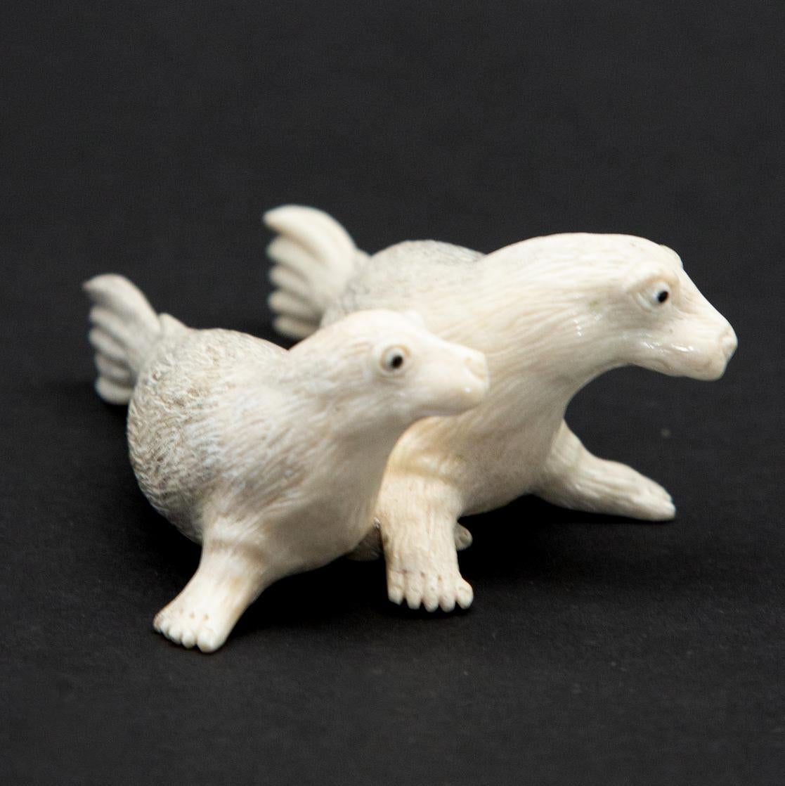 Sea lion couple moose antler carving. North American moose antler carving of a couple of sea lions. This is a one of a kind object. The moose antler was sourced in North America and carved in Indonesia. Quality of ivory, but with sustainability, as