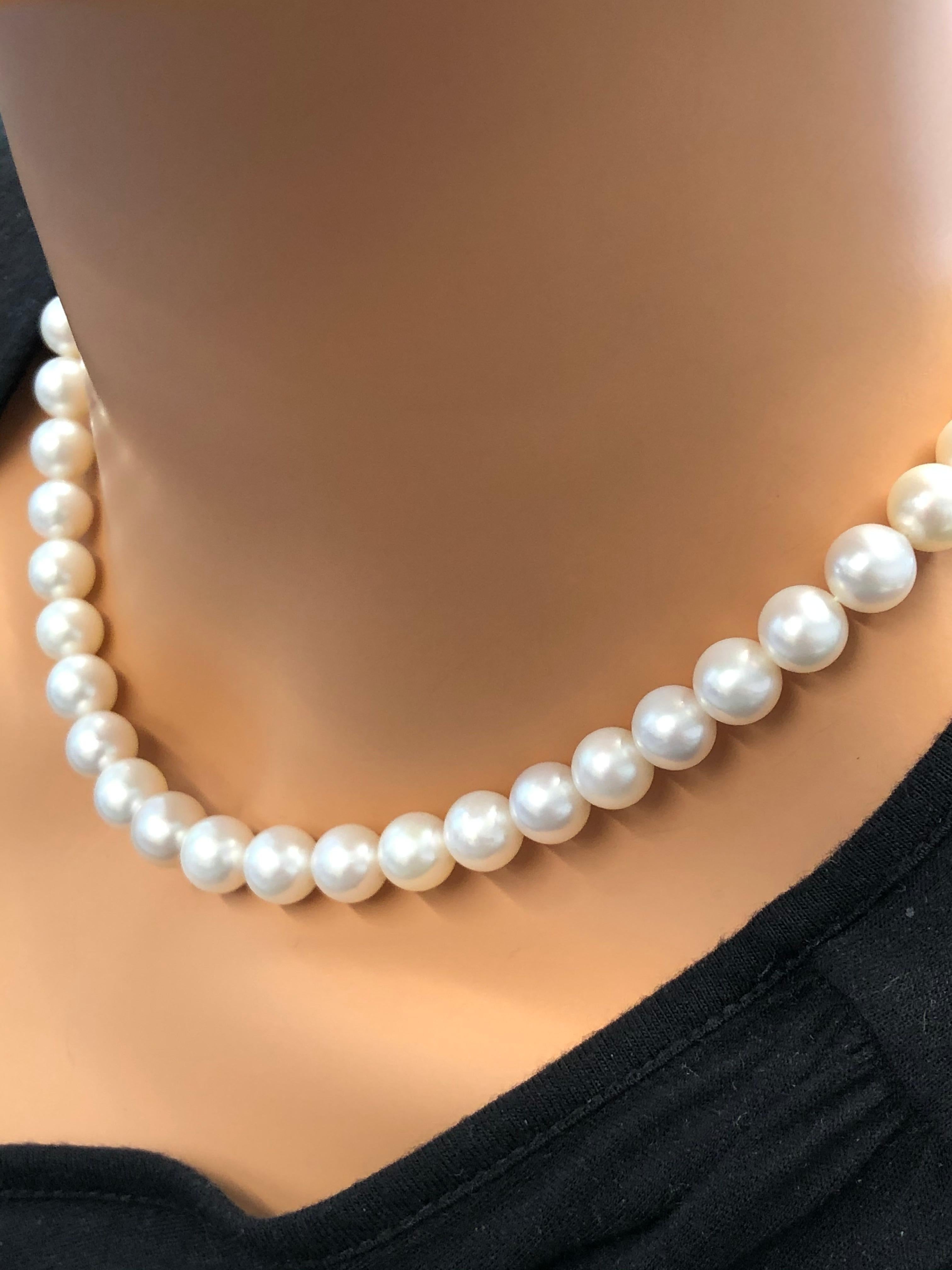 This classic pearl strand necklace is the ultimate statement in luxury with its seamless elegance. A total of 45 cultured white South Sea pearls are expertly strung on a single strand, matched evenly in color throughout. A silver filigree clasp adds