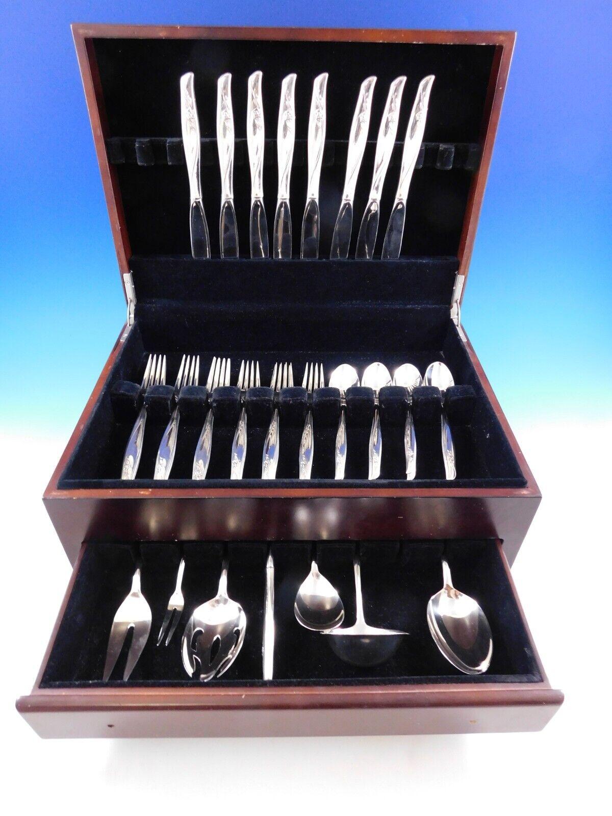 Beautiful Sea Rose By Gorham sterling silver Flatware set, 63 pieces. This pattern has a flowing modern design and was designed by Richard L. Huggins in the year 1958. This set includes:
 
·         8 Knives, 9 1/4