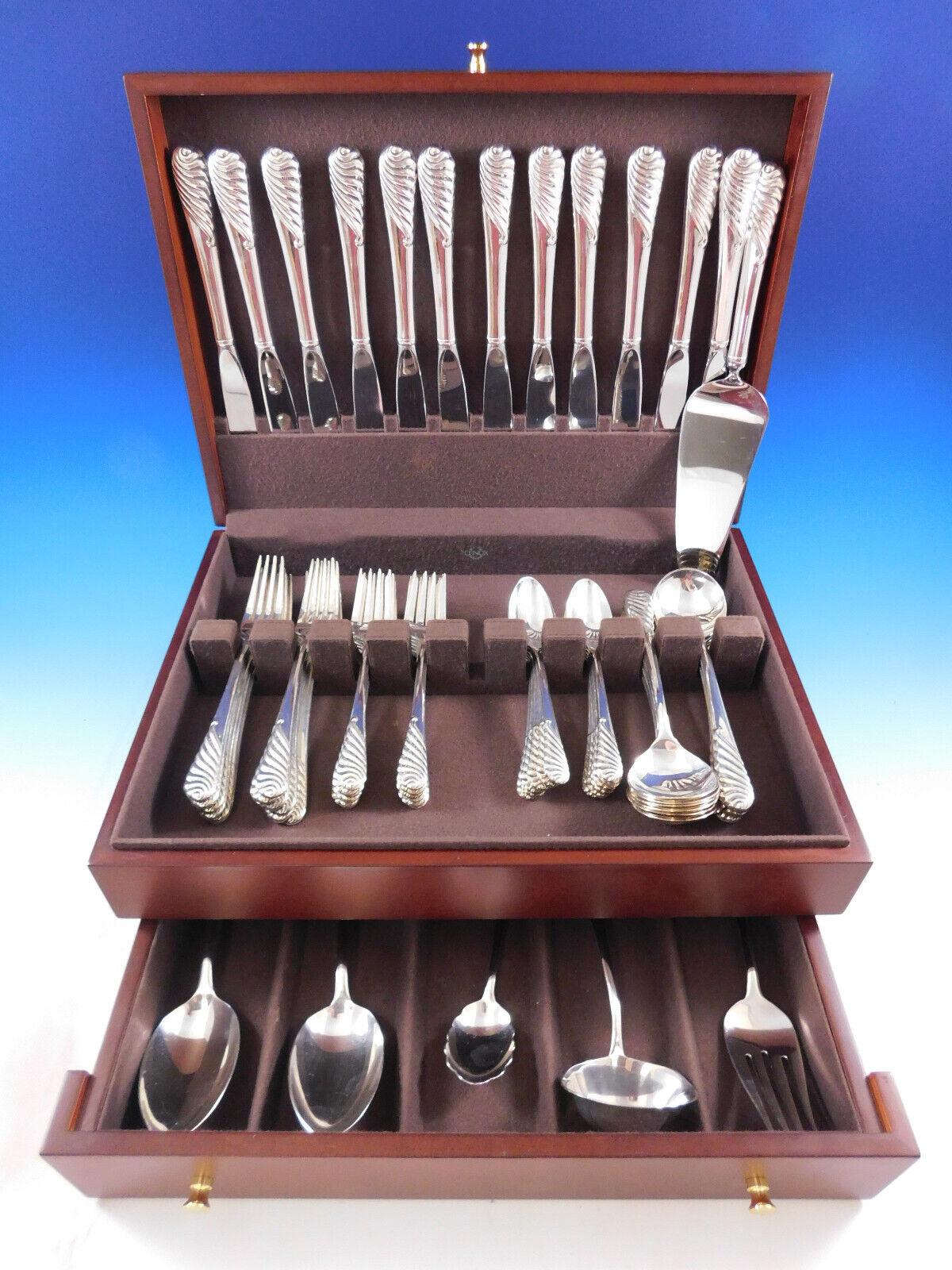 Sea Sculpture by Gorham sterling silver Flatware set - 66 pieces. This pattern would be perfect for a modern home. It has a wave-like design, reminiscent of the sea. This set includes:

12 Knives, 9