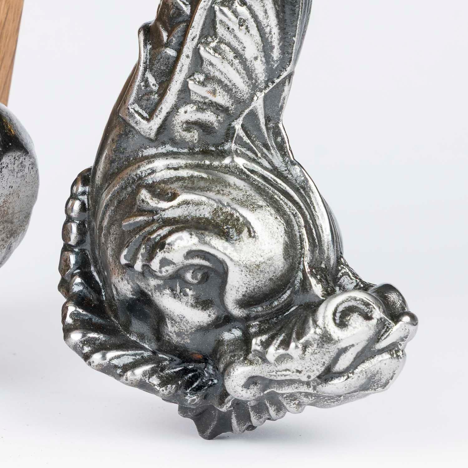 A large 19th century cast iron door knocker in the form of a sea serpent by Archibald Kenrick & Sons, with matching stamped scallop shaped striking plate.

Kenrick & Sons model no. 11367.

 


Archibald Kenrick & Sons, Ltd., Spons Lane, West