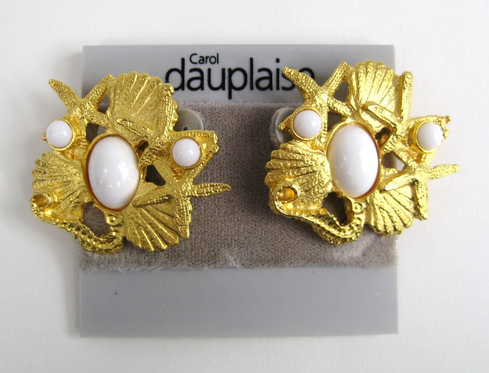 Carol Dauplaise is a former employee of Miriam Haskell. Company founded in 1979. This set is New Old stock, never worn with a Sea Shell Motif. Earrings on clip on's. Measuring 1.38 in.  top to bottom x 1.5 in. wide. This is out of a massive