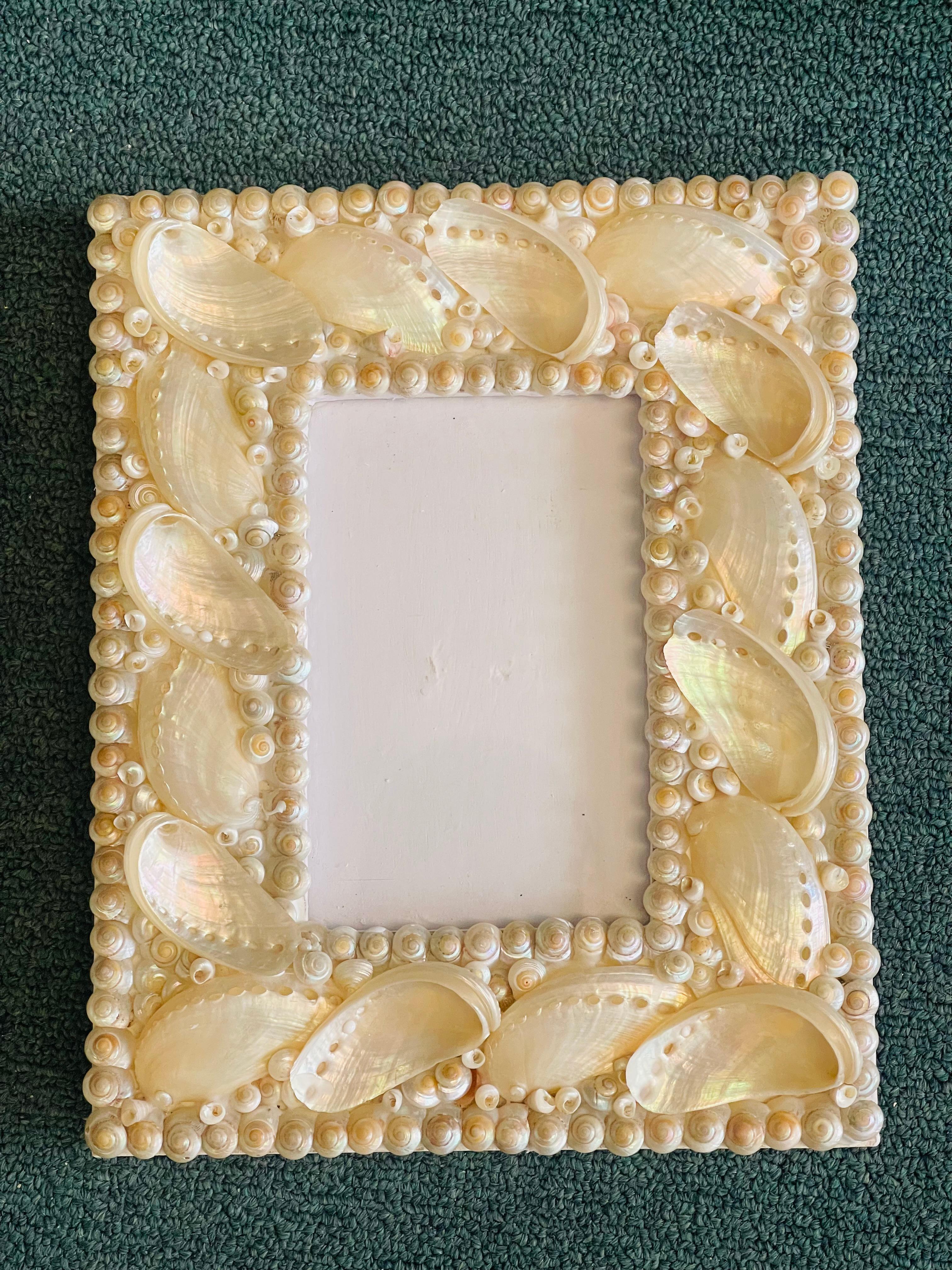 Splendid Coastal sea shell encrusted photo frame. Great coastal marine decor.