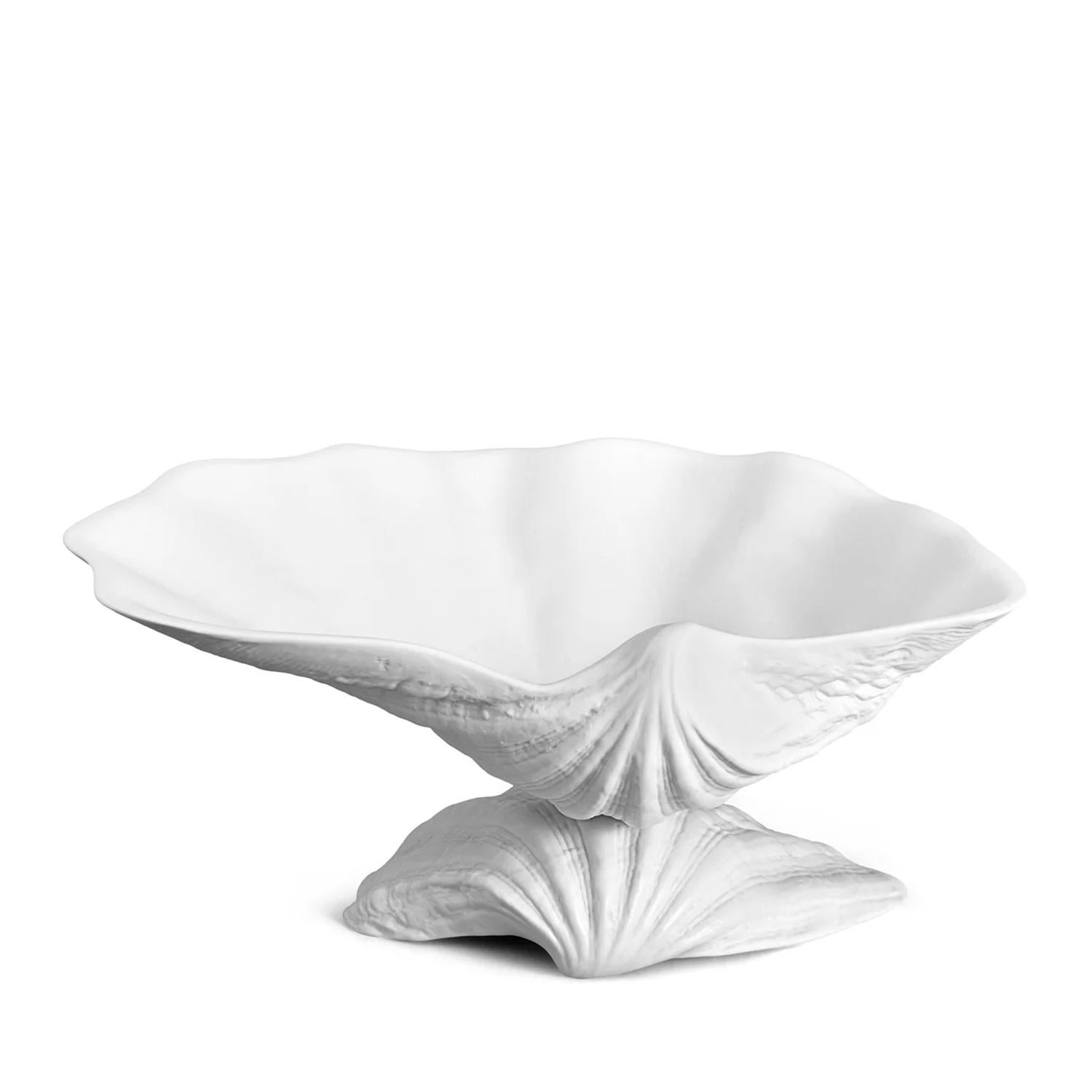 Plat Sea Shell Medium avec toute la structure en 
Porcelaine fine fabriquée à la main en finition blanche.
Livré dans un luxueux coffret cadeau.