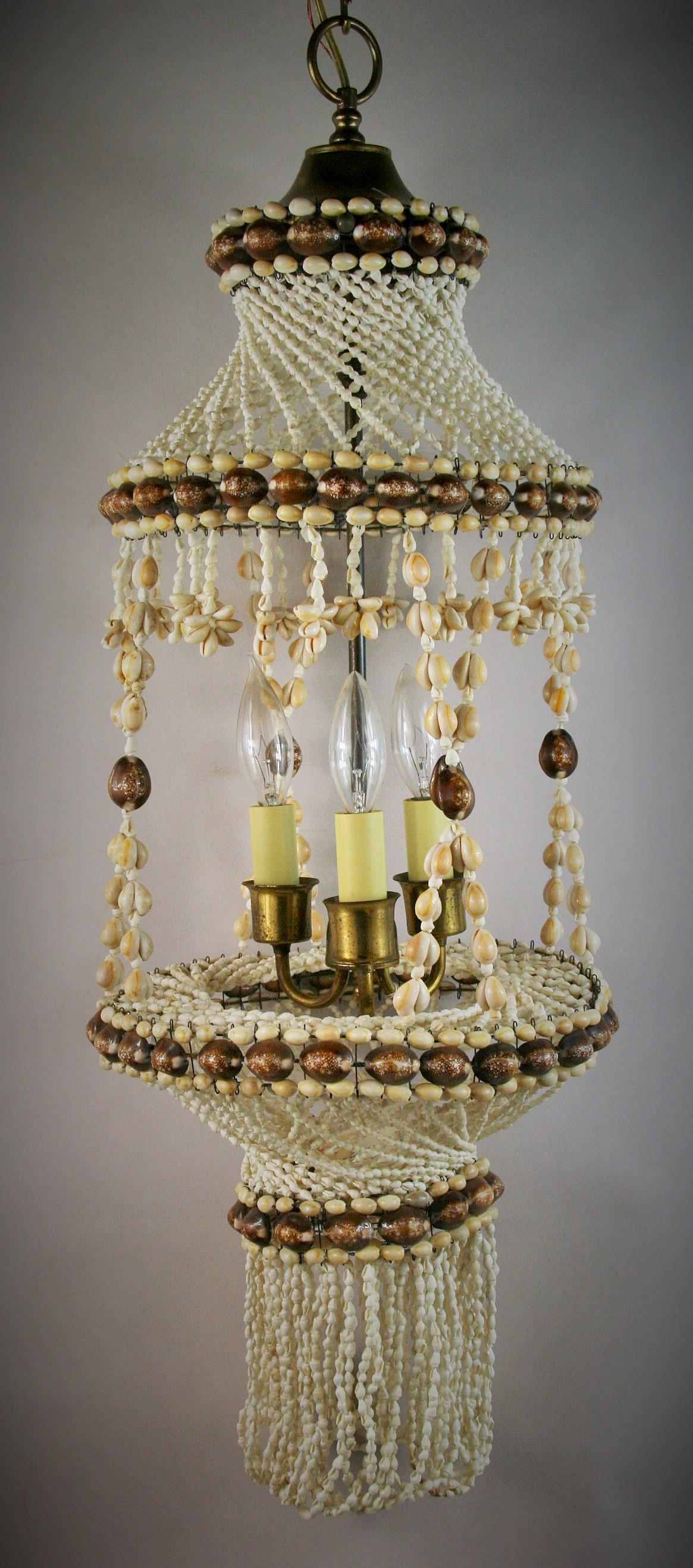 3-417 sea shell 3 light hanging pendant light
Made from various sizes and colored sea shell from the Philippines
Brass hardware
Takes 3 candelabra base bulbs 60 watt max.