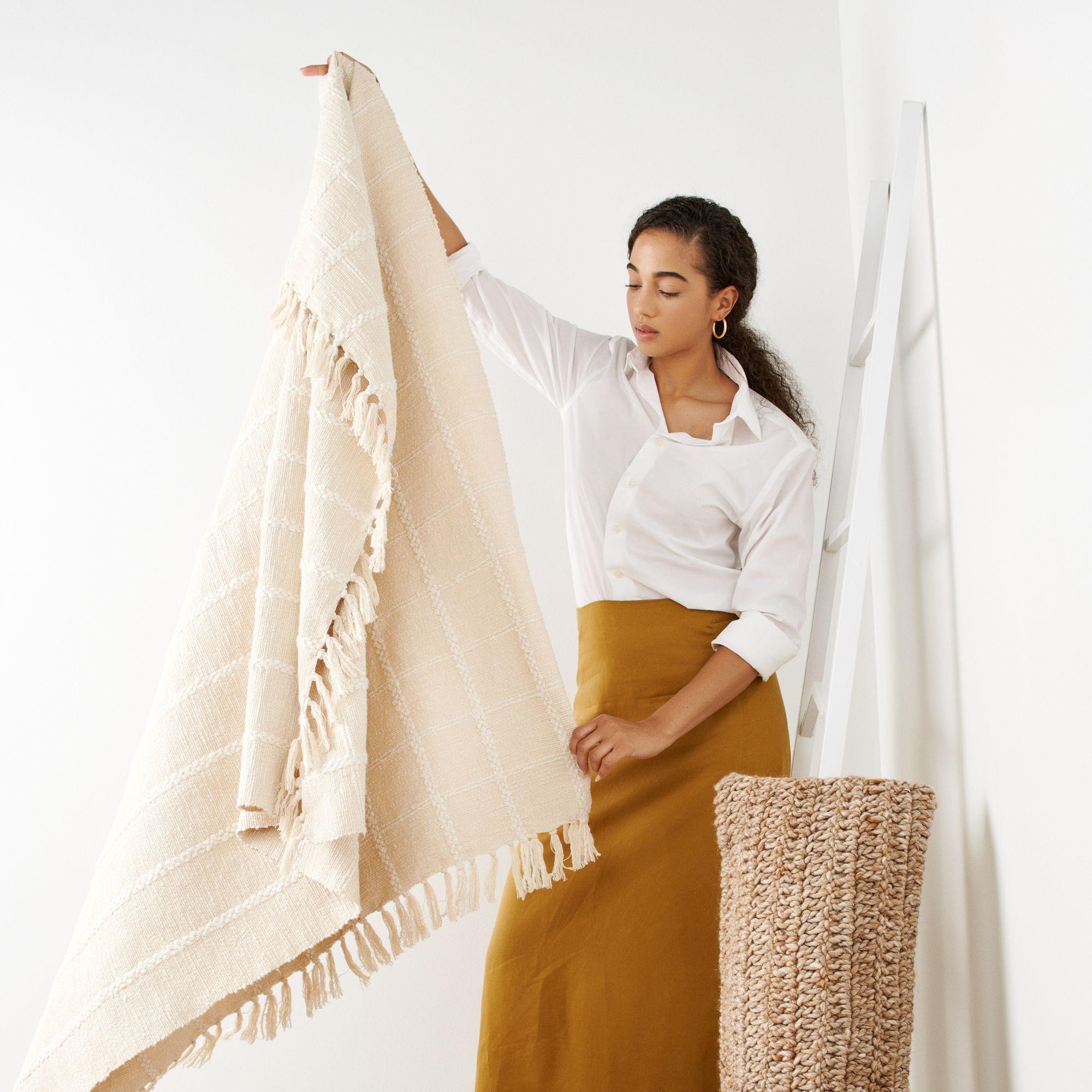 Sea Shell Throw is handwoven by weavers in India. The design of Sea Shell Throw  is made up of subtle textured checks pattern. Edges of this throw are made up of hand rolled fringes. 

Our textiles are incredibly soft textural feel and wears well