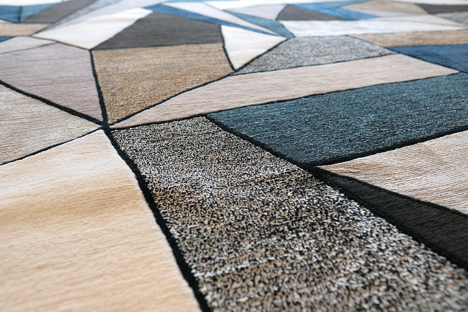 This is not your grandmother’s rug (no offence to your grandmother). Multiple silk colors and wool are carded together in an assemblage of geometric shapes alluding to the surface of the ocean. Whether stormy or clear, the colors are perfect for