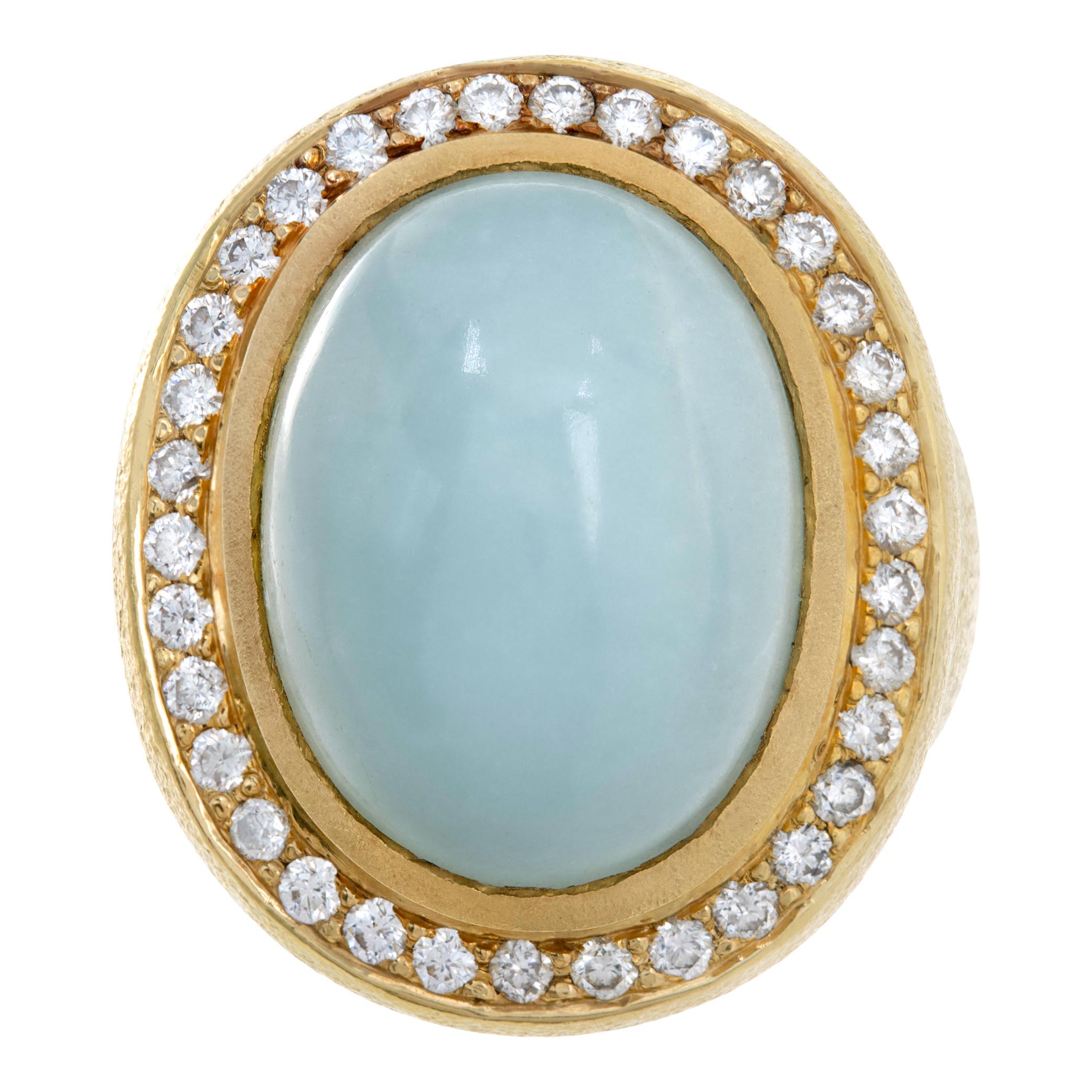 Seafoam chalcedony ring with 1 carat in G-H color, VS clarity diamond accents. Size 6.5, head measures 27.5 mm x 24 mm.

This Diamond ring is currently size 6.5 and some items can be sized up or down, please ask! It weighs 20.9 pennyweights and is