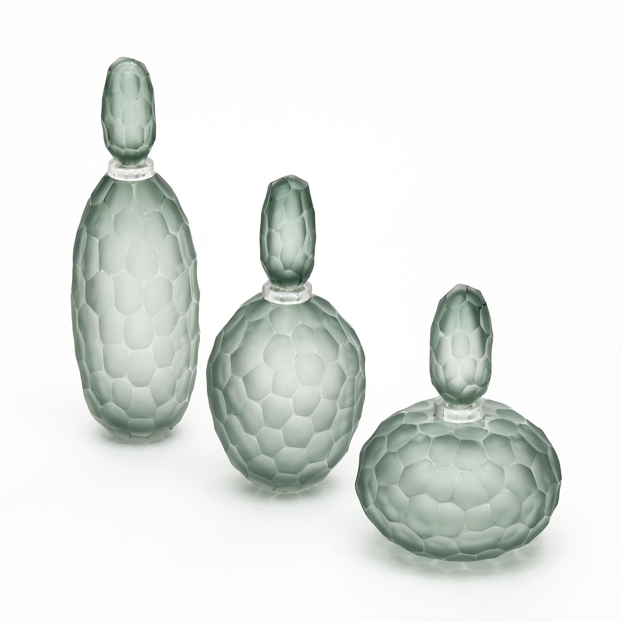 Trio of bottles from the Island of Murano outside of Venice, Italy. This set is made using the “Ferro Battuto” technique in the Manner of Carlo Scarpa. 

 
Large

Height: 17”

Diameter: 5”


Medium

Height: 13.875