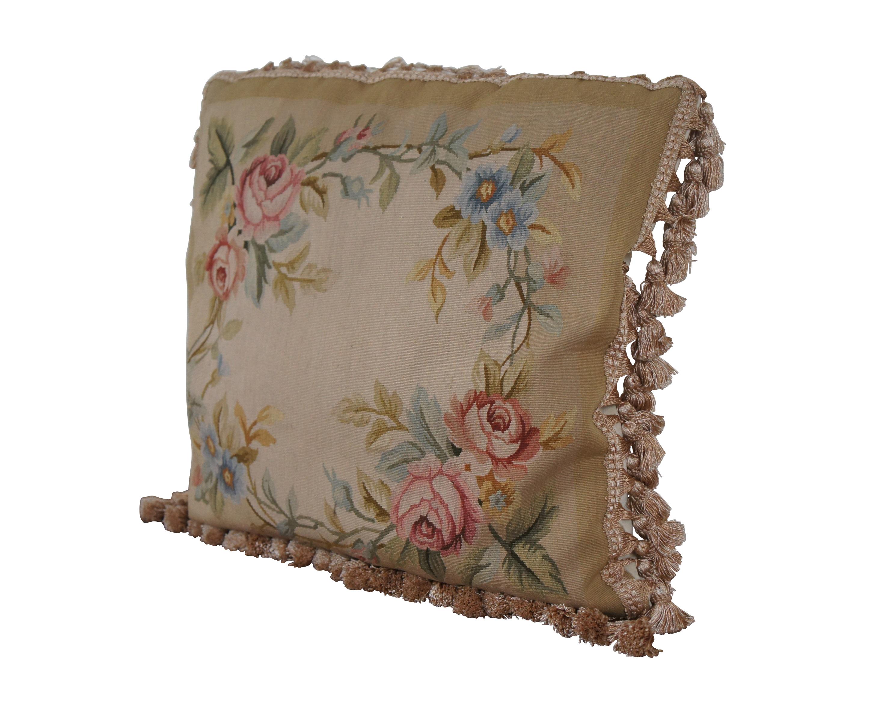 20th century French Aubusson style square throw pillow, embroidered in silk with a wreath of stems / branches sporting blue and yellow flowers and large pink roses on a two tone beige background. Cream velour back with zipper closure. Beige and