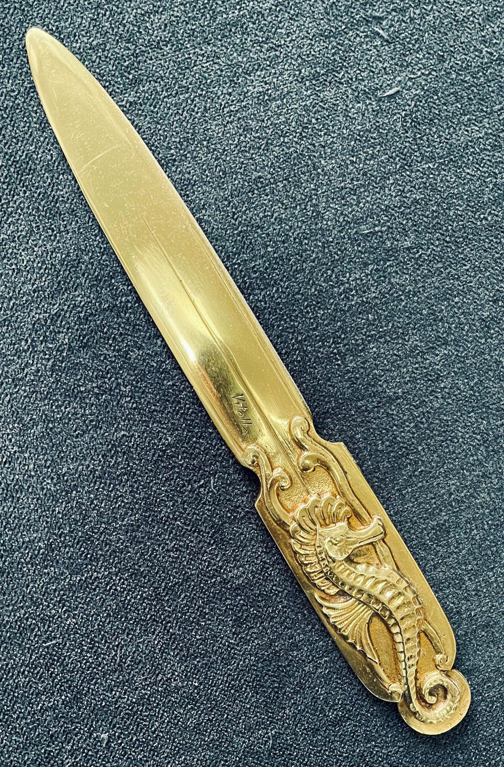 Rare and beautifully crafted, this Art Deco letter opener features a high relief seahorse on its handle and a wide, tapering blade, all in a gold-toned bronze. The sculptor was Vitello, a French artist who specialized in very fine bronze desk items