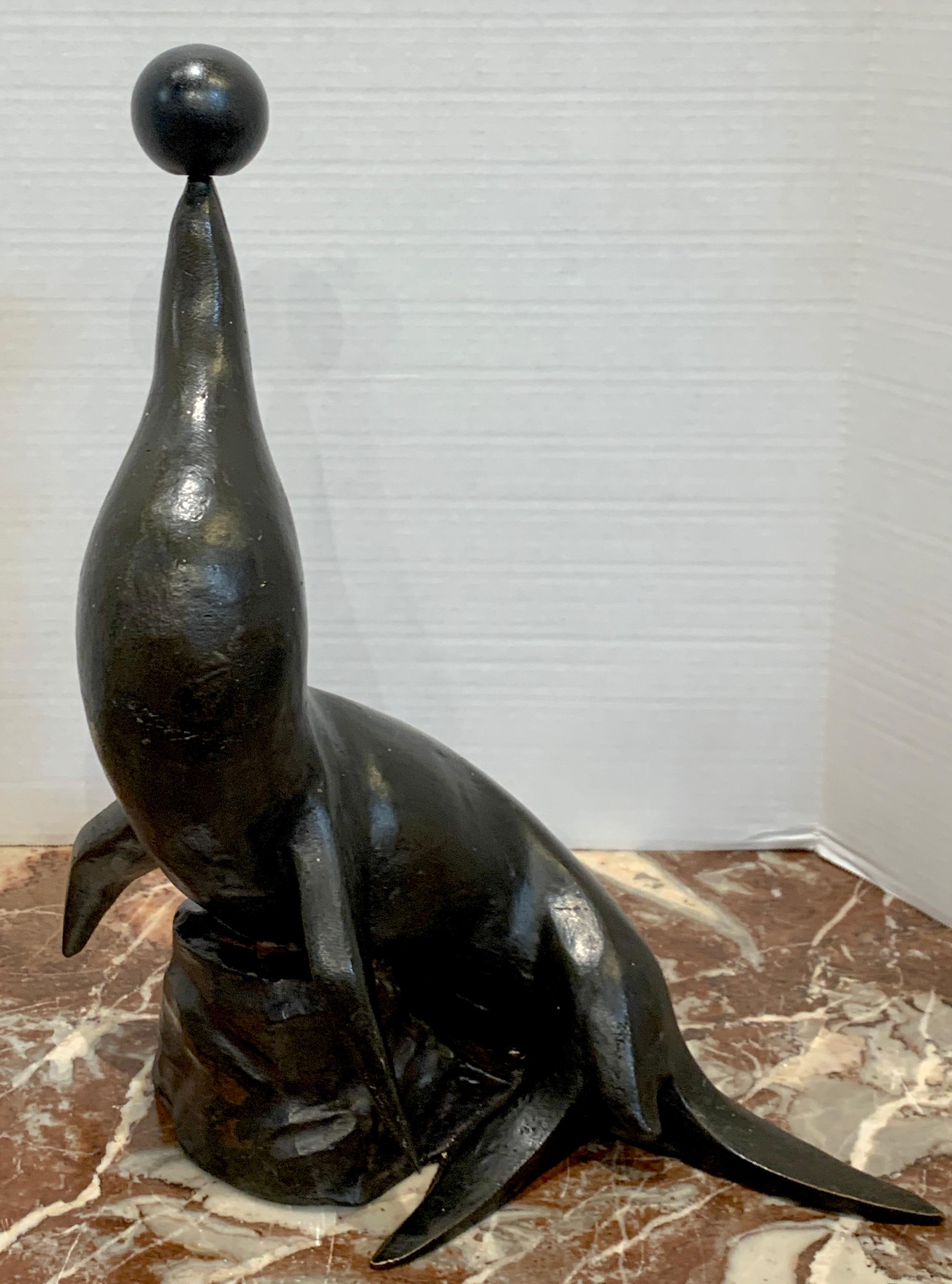 Seal, 1930 by Rueben Nakian
Reuben Nakian, American, (1897–1986)
A fine example with associated ball Signed 'Nakian' and Copyrighted, 
Another example of this sculpture is in Whitney Museum of American Art, gifted by Gertrude Vanderbilt