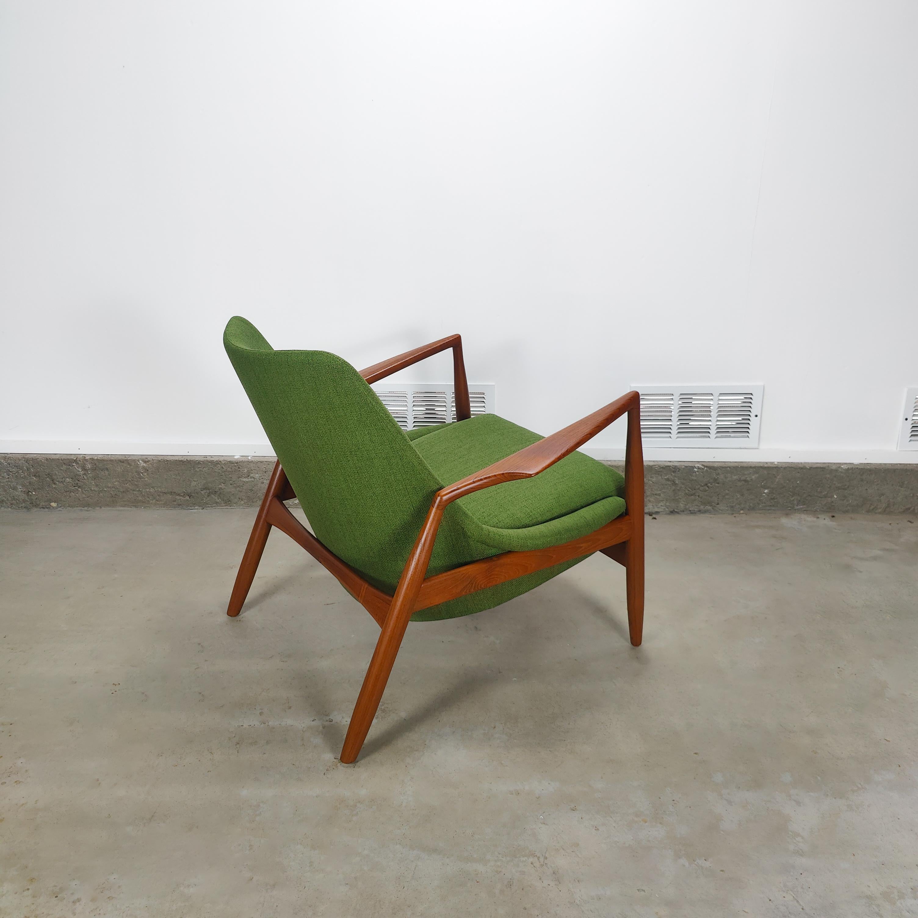 Just in, a stunning lounge chair by Ib Kofod-Larsen for OPE. Features a fully restored teak frame in excellent condition with new green fabric. Measures approximately 31.5