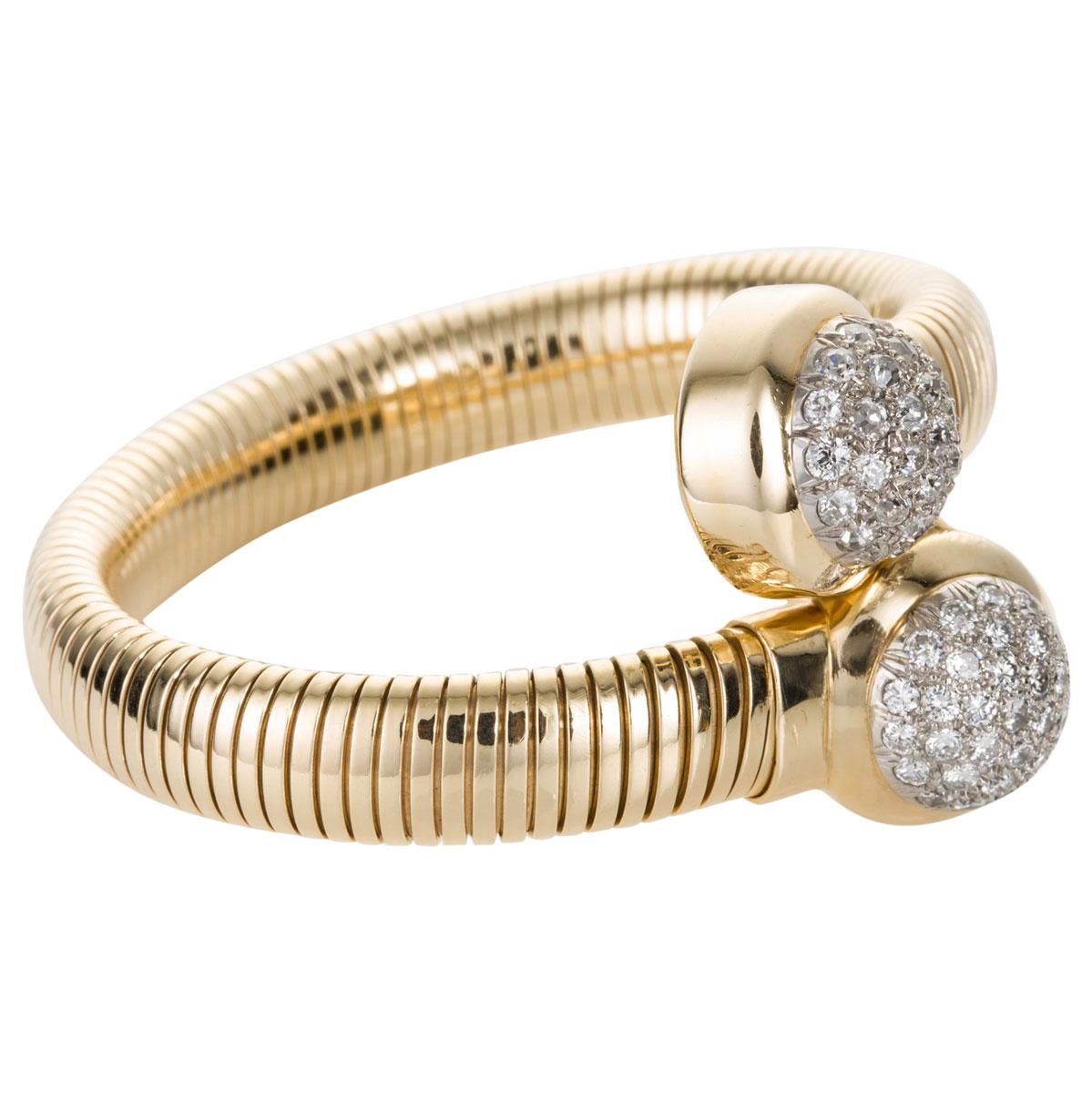 Seaman Schepps known as 'America's Court Jeweler' and established in 1904, make the most stylish and sophisticated pieces and this bangle is no exception. Featuring the amazing Tubogas work it is flexible and so comfortable to wear, 14k yellow gold