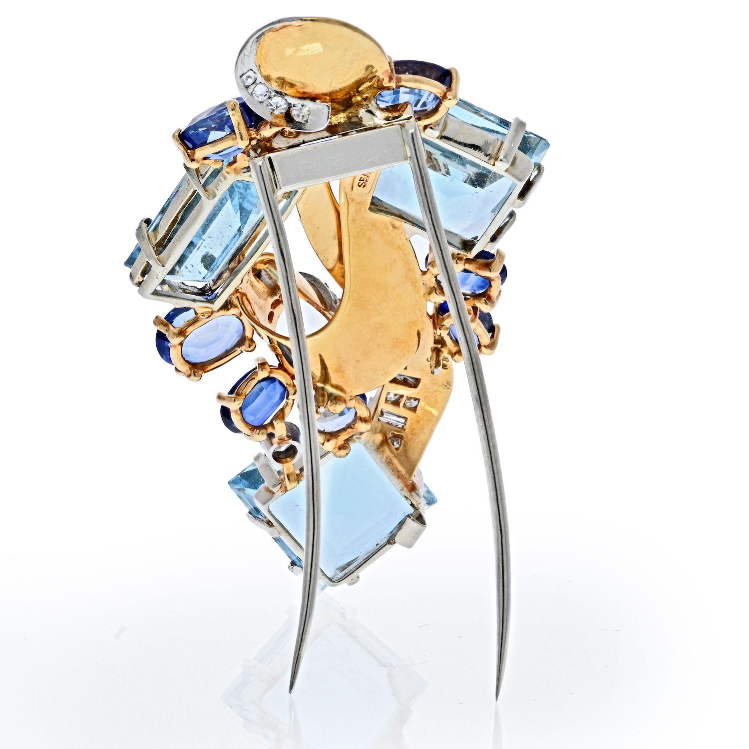 Beautiful and somewhat geometric this brooch by Seaman Schepps circa 1940's is masterfully crafted in 14K gold, featuring aquamarines, sapphires and diamonds. There are plenty of ways to dress this brooch up or down. One thing we know you will love