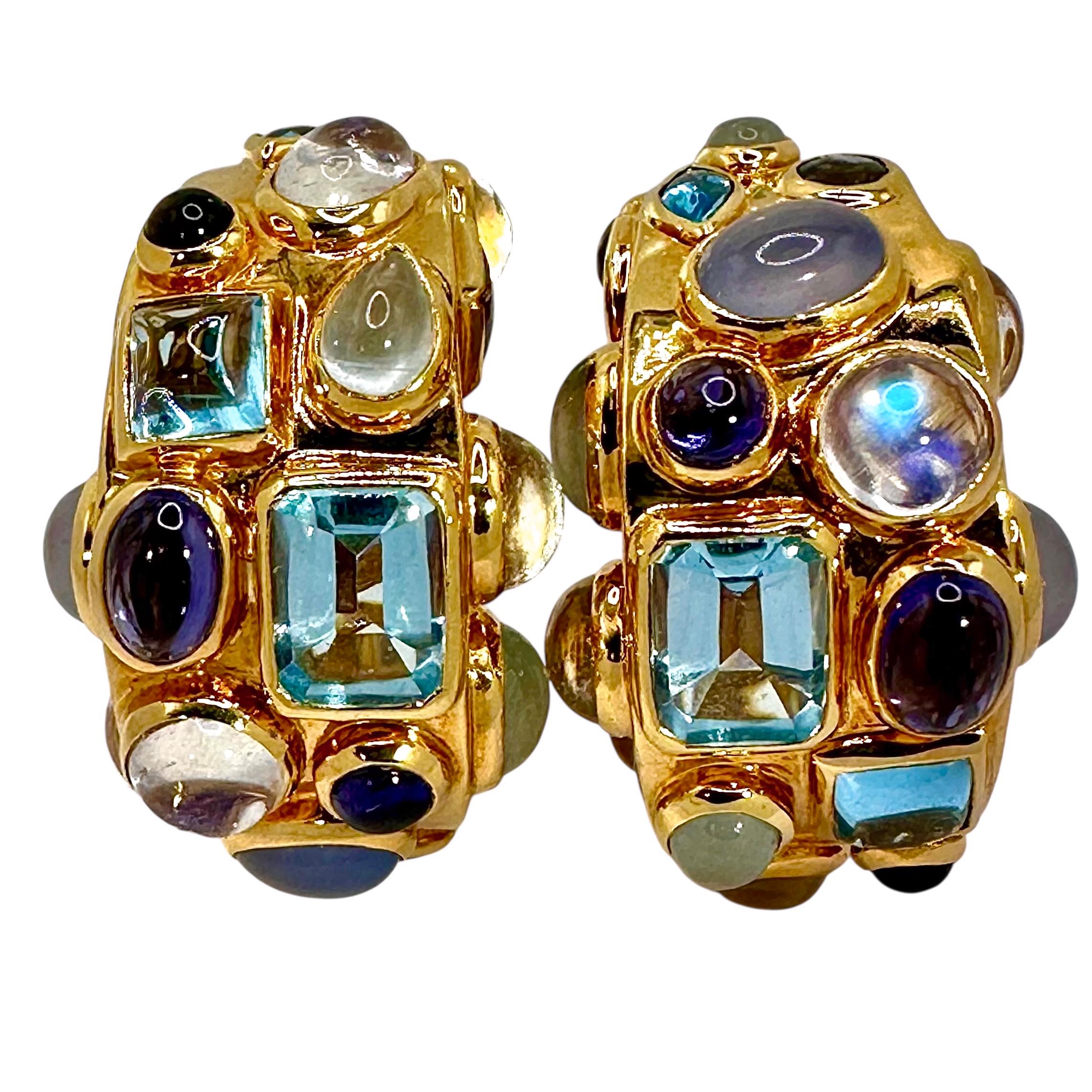 Seaman Schepps, one of the truly original and innovative of 20th Century American Fine jewelry designers, Imagined and created this wonderful fantasy in 18K yellow gold with a variety of natural gemstones. They refer to this style as Fifties Hoop