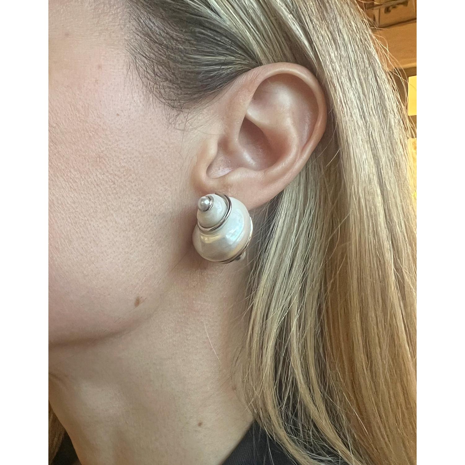 Seaman Schepps turbo shell earrings, handcrafted in 18k white gold with cultured pearl terminals.  5mm cultured pearl end caps.  Clip backs (posts may be added upon customer request).  Signed ‘SEAMAN SCHEPPS © 750’ and numbered ‘23355’.  1.1