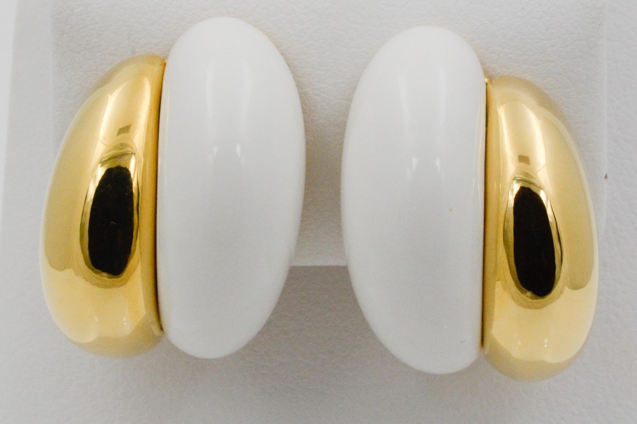 From Seaman Schepps, these Silhouette earrings feature white ceramic and 18k yellow gold in a polished finish with clip backs. Signed Seaman Schepps.