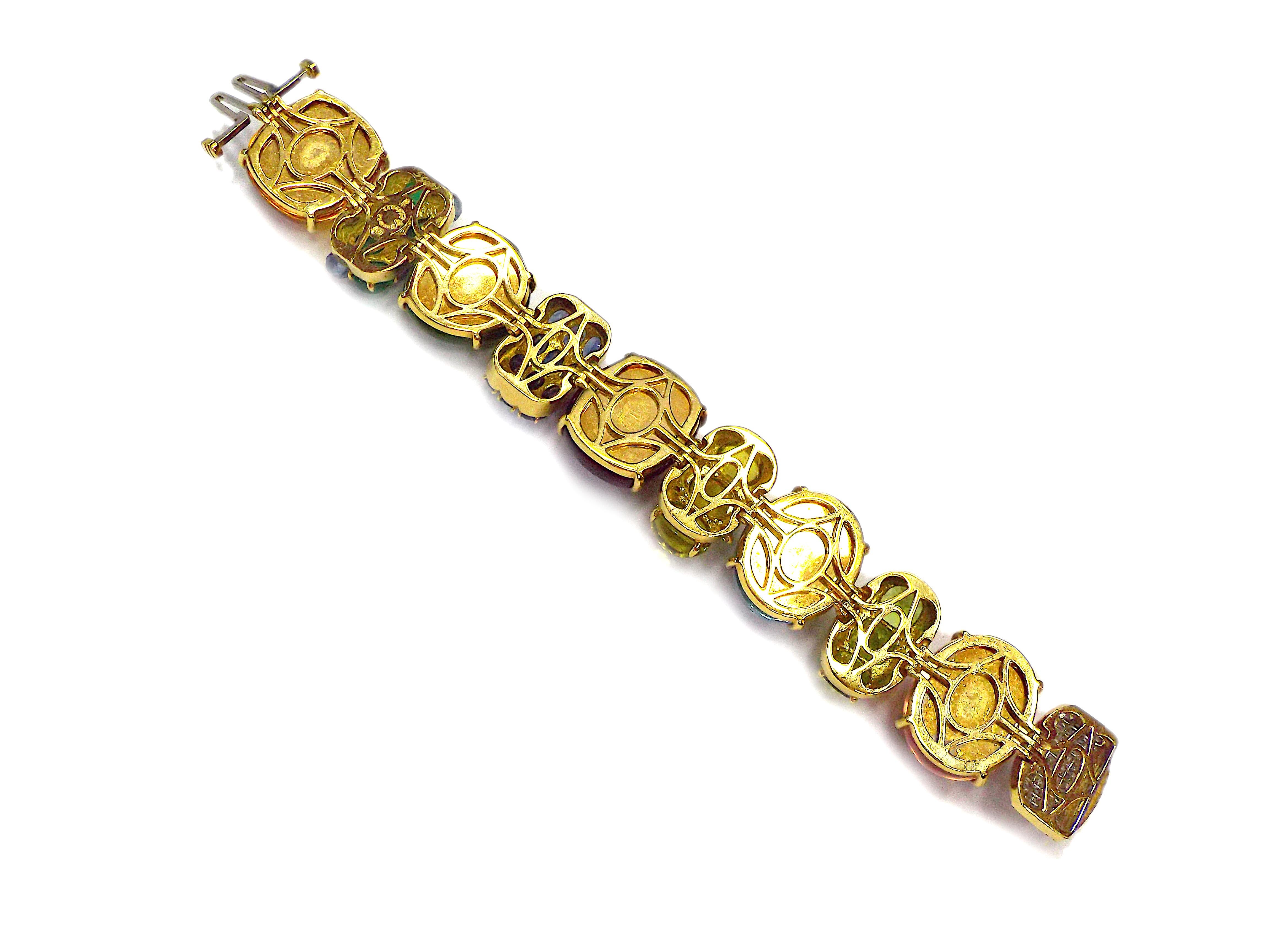 A fantastic multi gemstone bracelet by Seaman Schepps from Rio collection. Featuring sapphires, emeralds, rubies, peridots, citrines, rose quartz, tourmalines, topaz, aquamarines and diamond stones, mounted in 18K yellow gold. The length is 7
