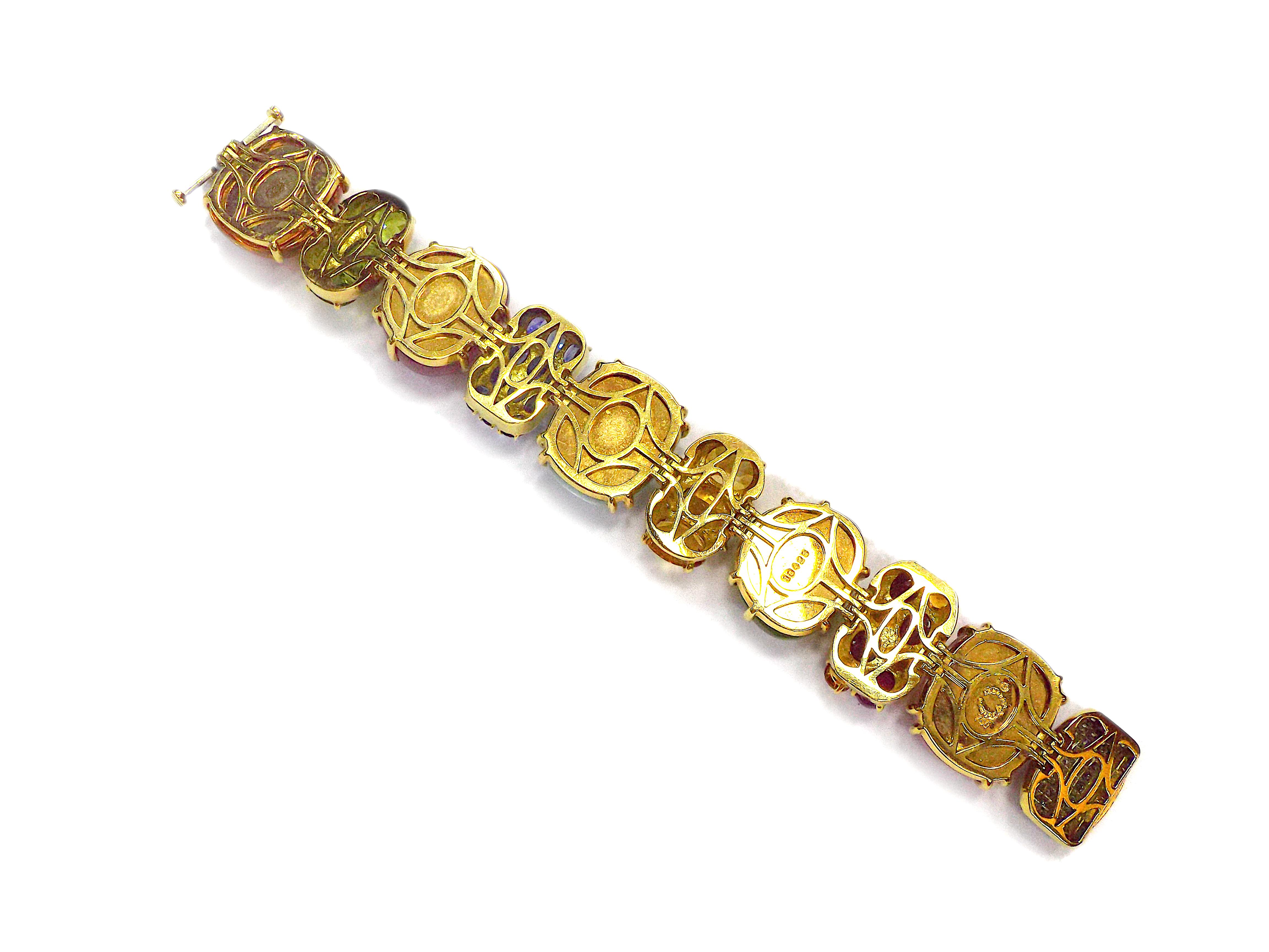 A fantastic multi gemstone bracelet by Seaman Schepps from Rio collection. Featuring sapphires, emeralds, rubies, peridots, citrines, rose quartz, tourmalines, topaz, aquamarines and diamond stones, mounted in 18K yellow gold. The length is 7.25