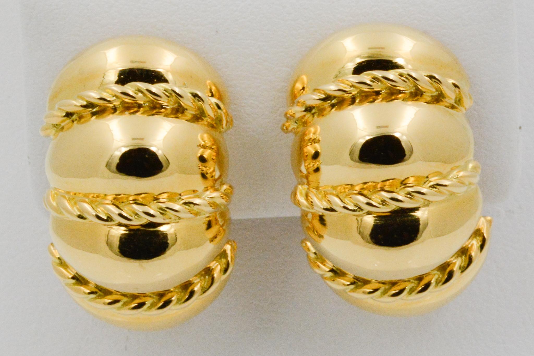 From Seaman Schepps, these 18k yellow gold Shrimp earrings have a rope design. Signed Seaman Schepps.