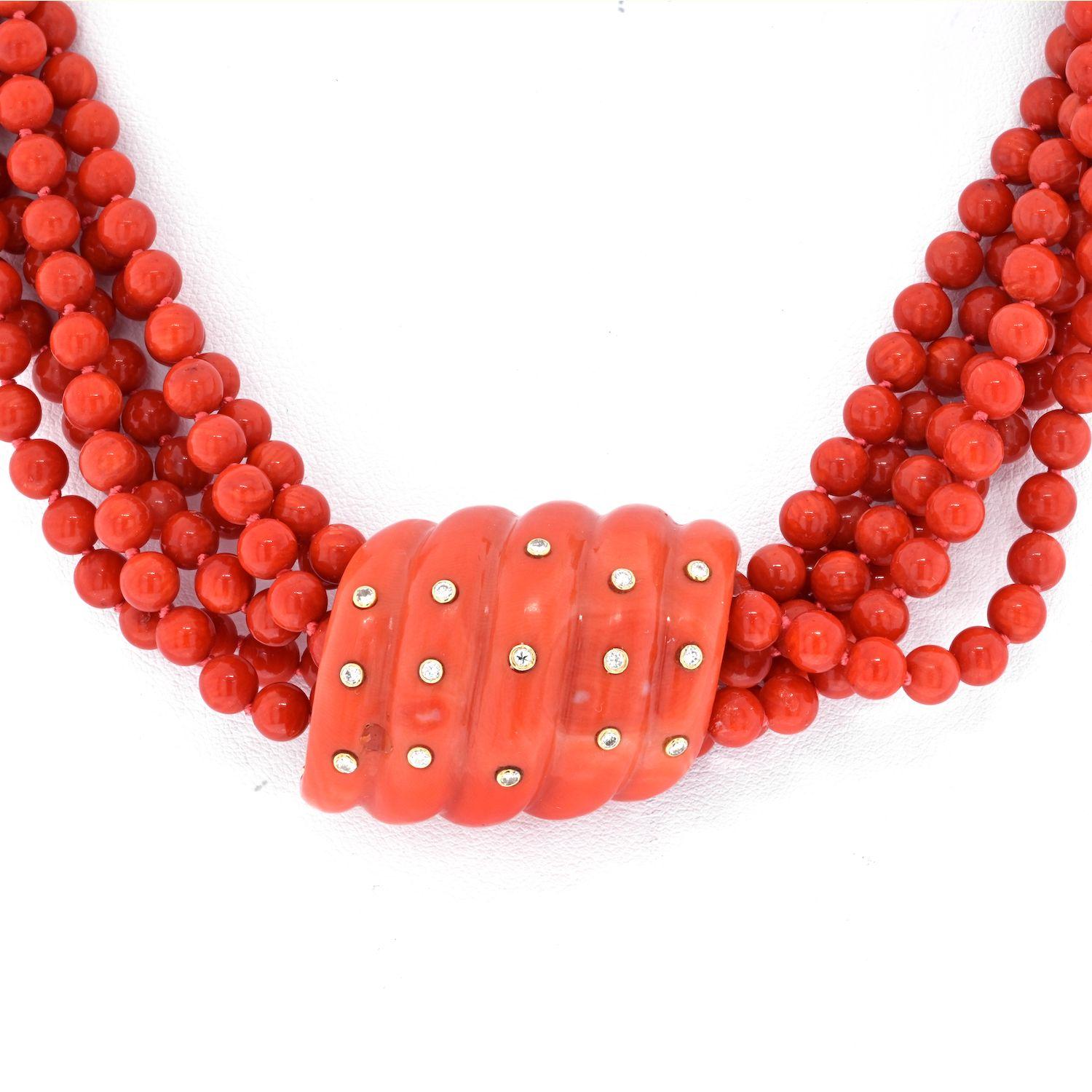 Of 6 beaded coral strands, joined by a fluted coral and round brilliant-cut diamond clasp
18K Yellow Gold. 
18 inches. 
The necklace is finished with a substantial clasp that is further adorned with diamonds.