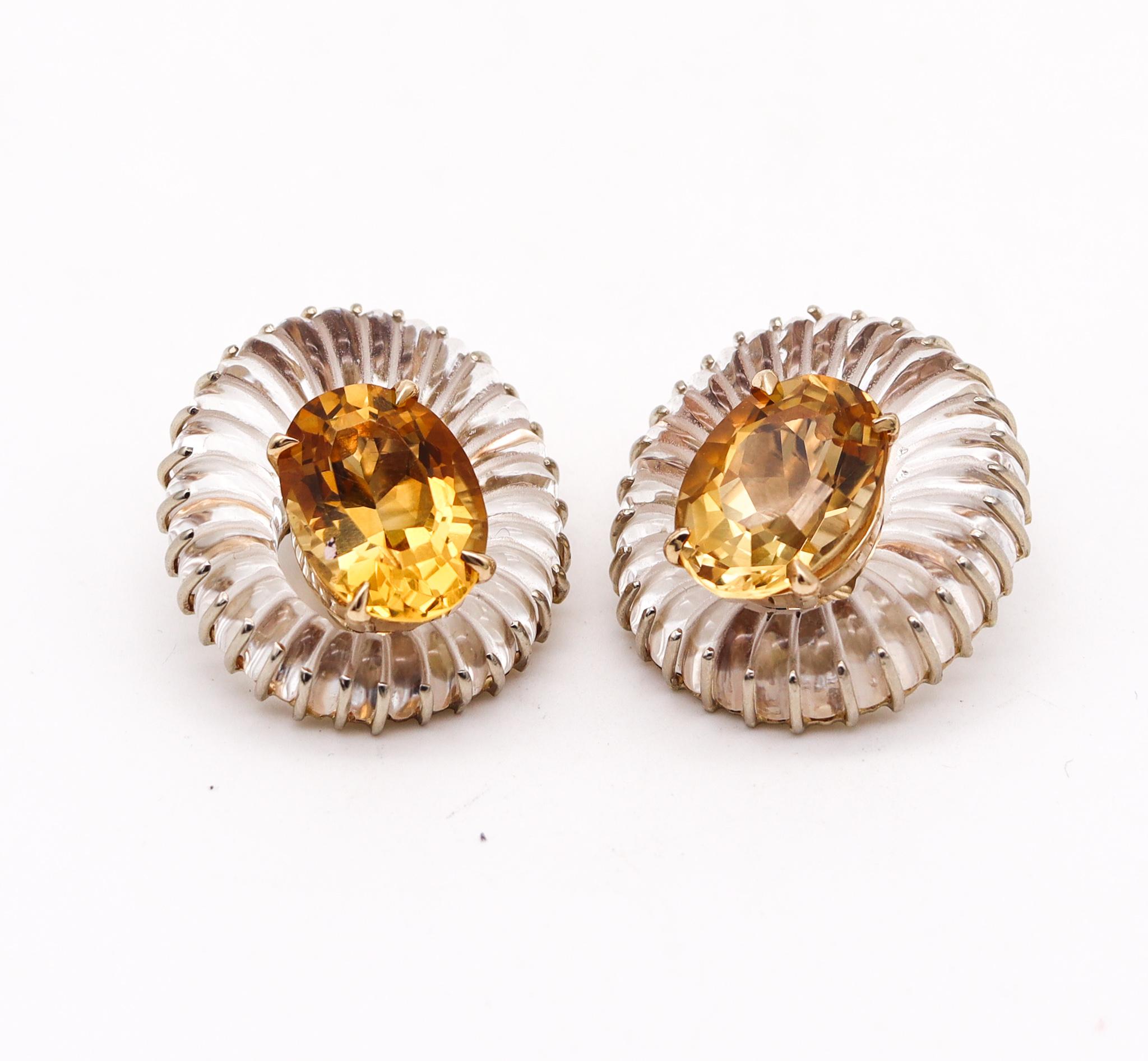 Fluted oval earrings designed by Seaman Schepps.

Gorgeous and very unusual vintage pair created in New York city at the Seaman Schepps atelier, back in the 1970. These oval clips earrings has been crafted in solid white and yellow gold of 14 karats